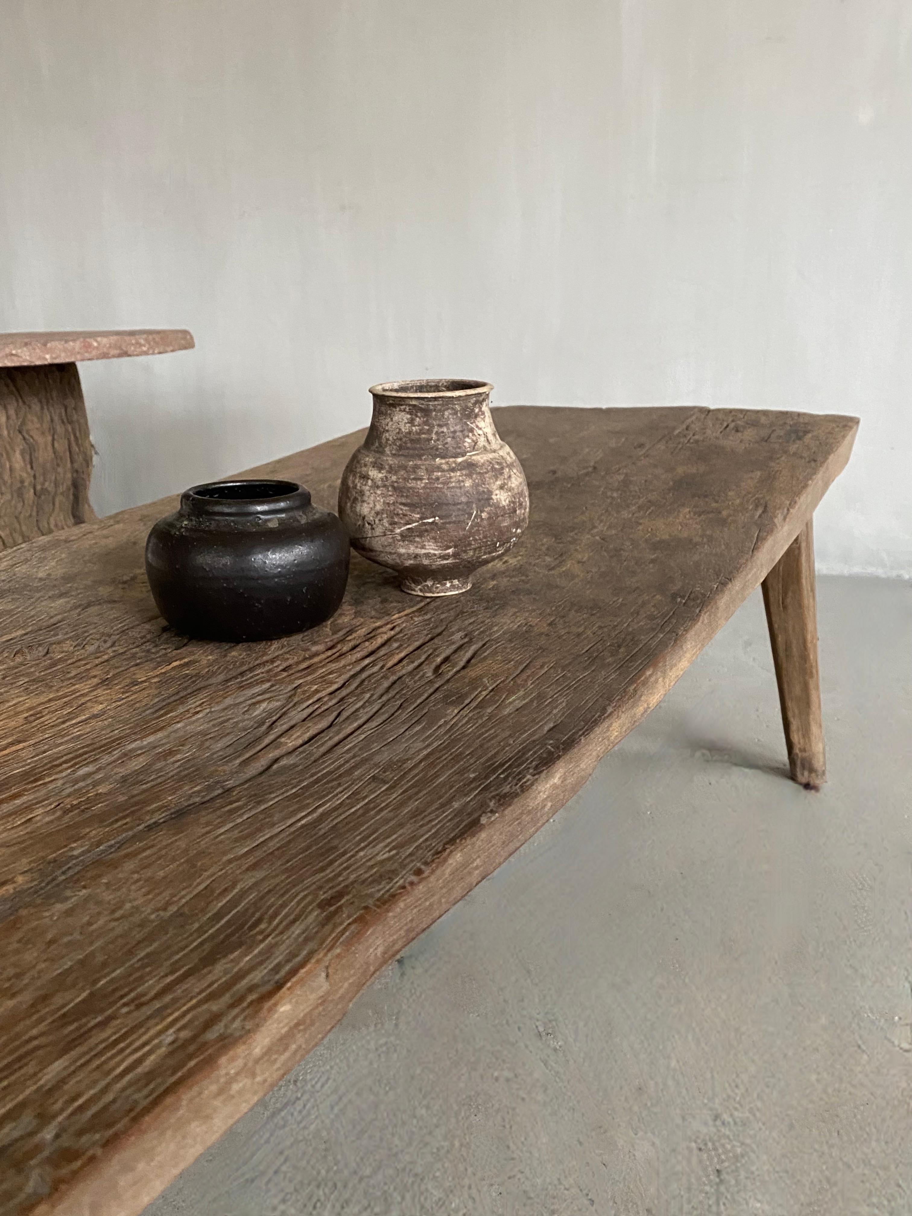 This beautiful unique piece can be used as a coffee table or as a wide bench.
It was a work table that was used to treat bread dough and acquired a lot of character through use.

The solid sculpted oak table is 41 cm high on the sides and 39 cm