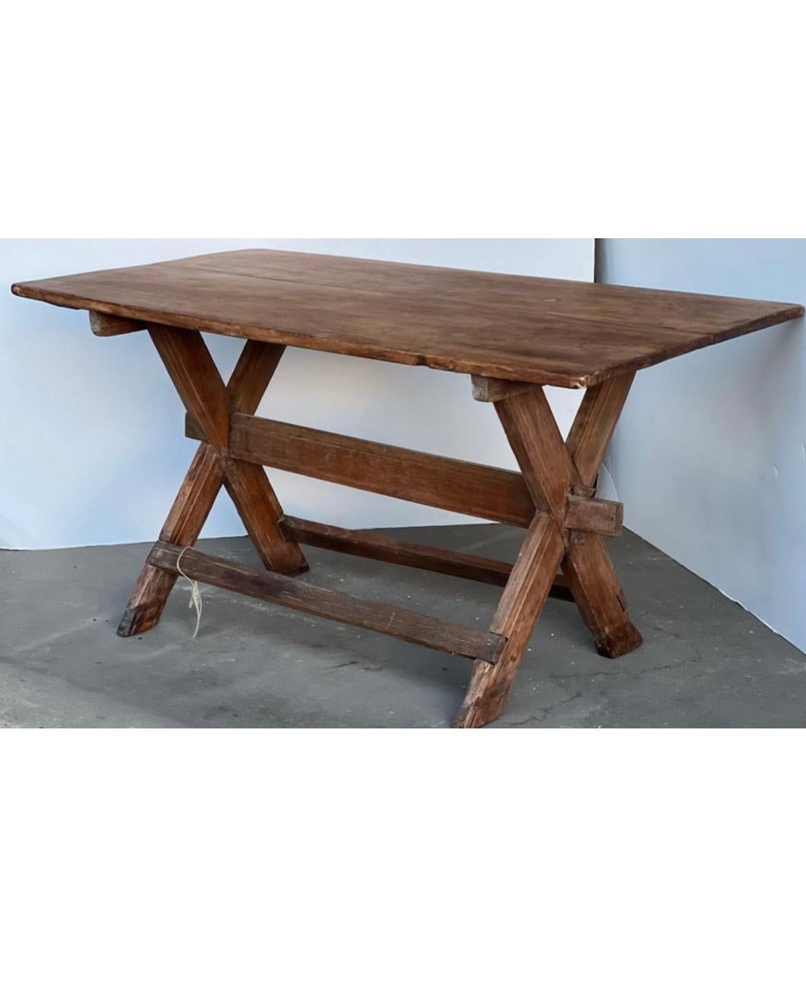 Here is a beautiful cross leg table that features a stretcher and excellent patina and more. This table is perfect for any wabi sabi, traditional, farmhouse or more design space. Perfect for a console table, desk or small kitchen area. This unique