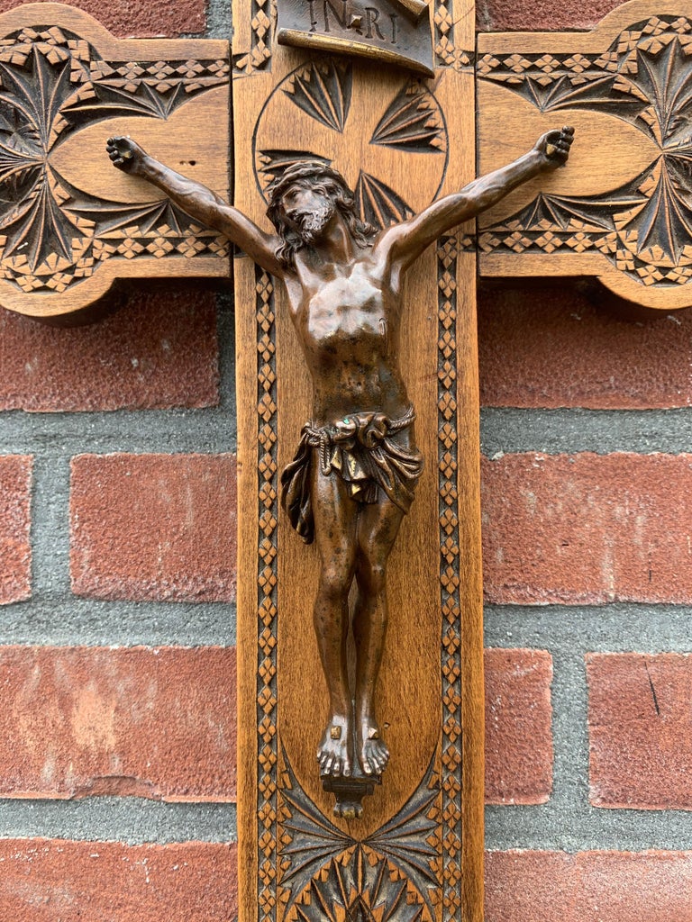 Stylish and meaningful antique work of Gothic art.

This Christian work of art dates from the late 19th century. Over the centuries wall crucifixes have been made in all kinds of shapes and sizes. This bronze Christ is small in size, but for a