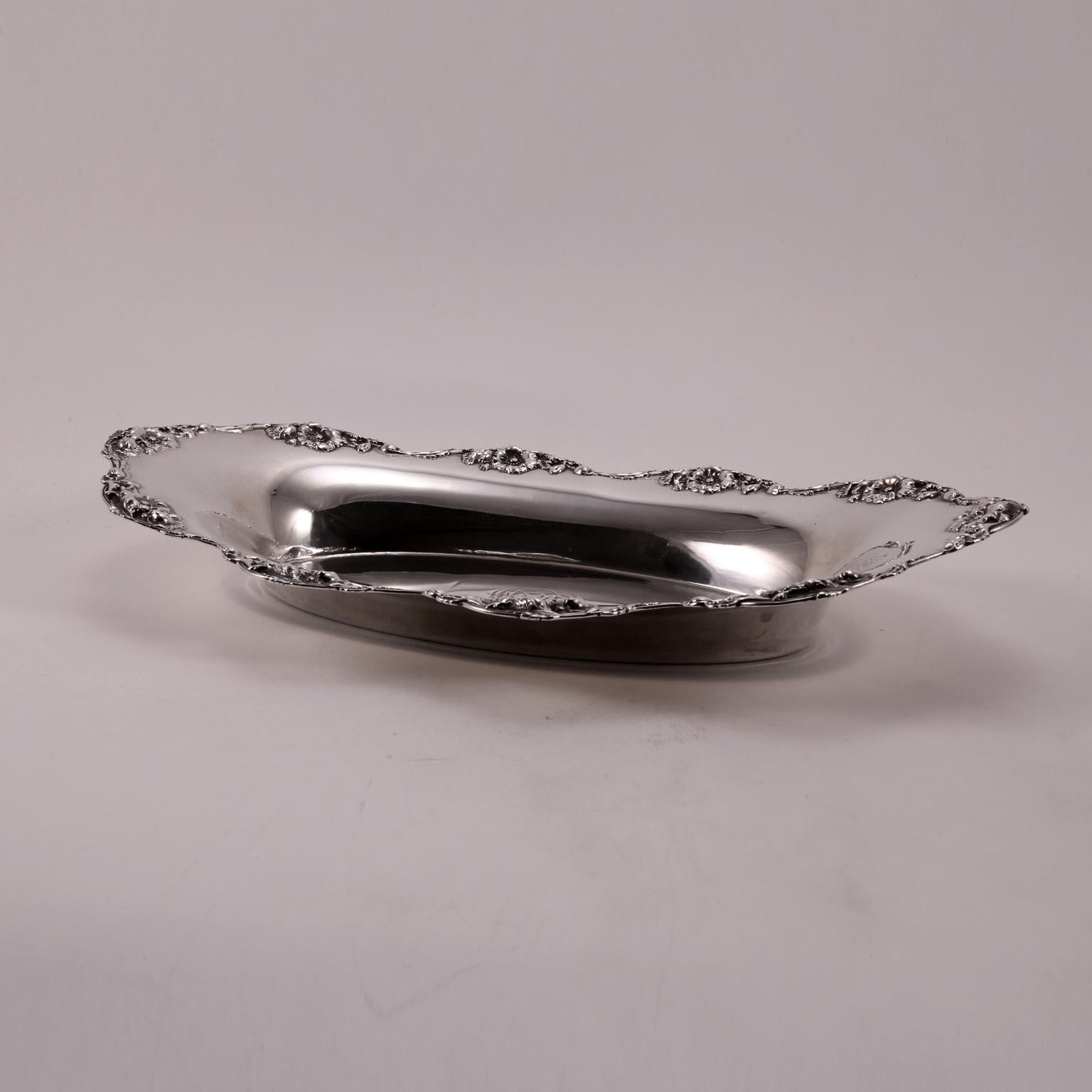 The beautiful floral decoration around the Edge, complete this cup, as if it were a refined lace.
The original hand engraved old English letters in the center, complete the beauty of this rare piece.
Produced by R.Wallace Sons Mfg. Co Wallingford