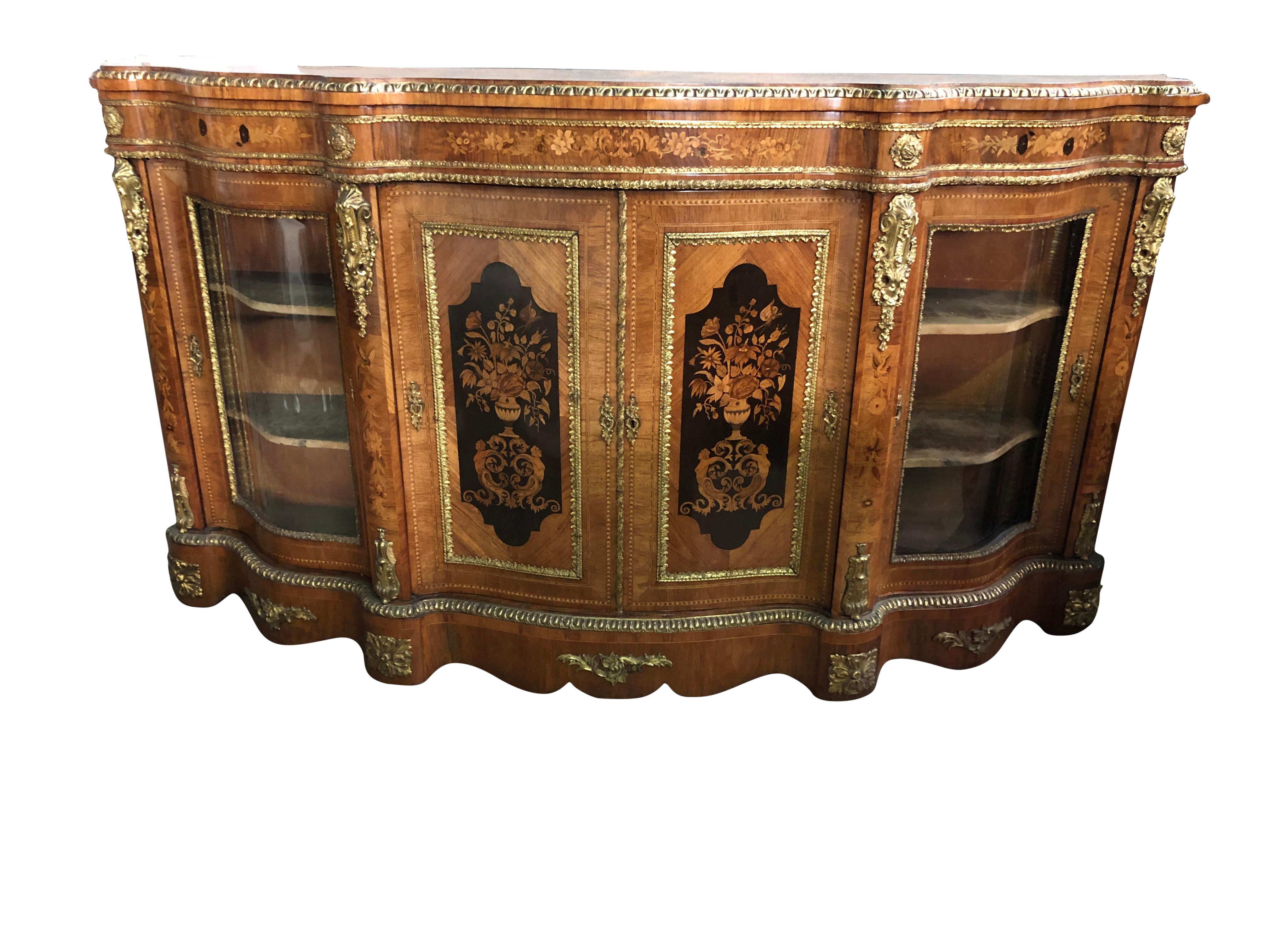 An imposing fabulous quality 19th century walnut and floral marquetry credenza of serpentine form, the wonderfully shaped top having ormolu moulding, the shaped frieze below decorated with floral marquetry and ormolu beading and carved patraes, the