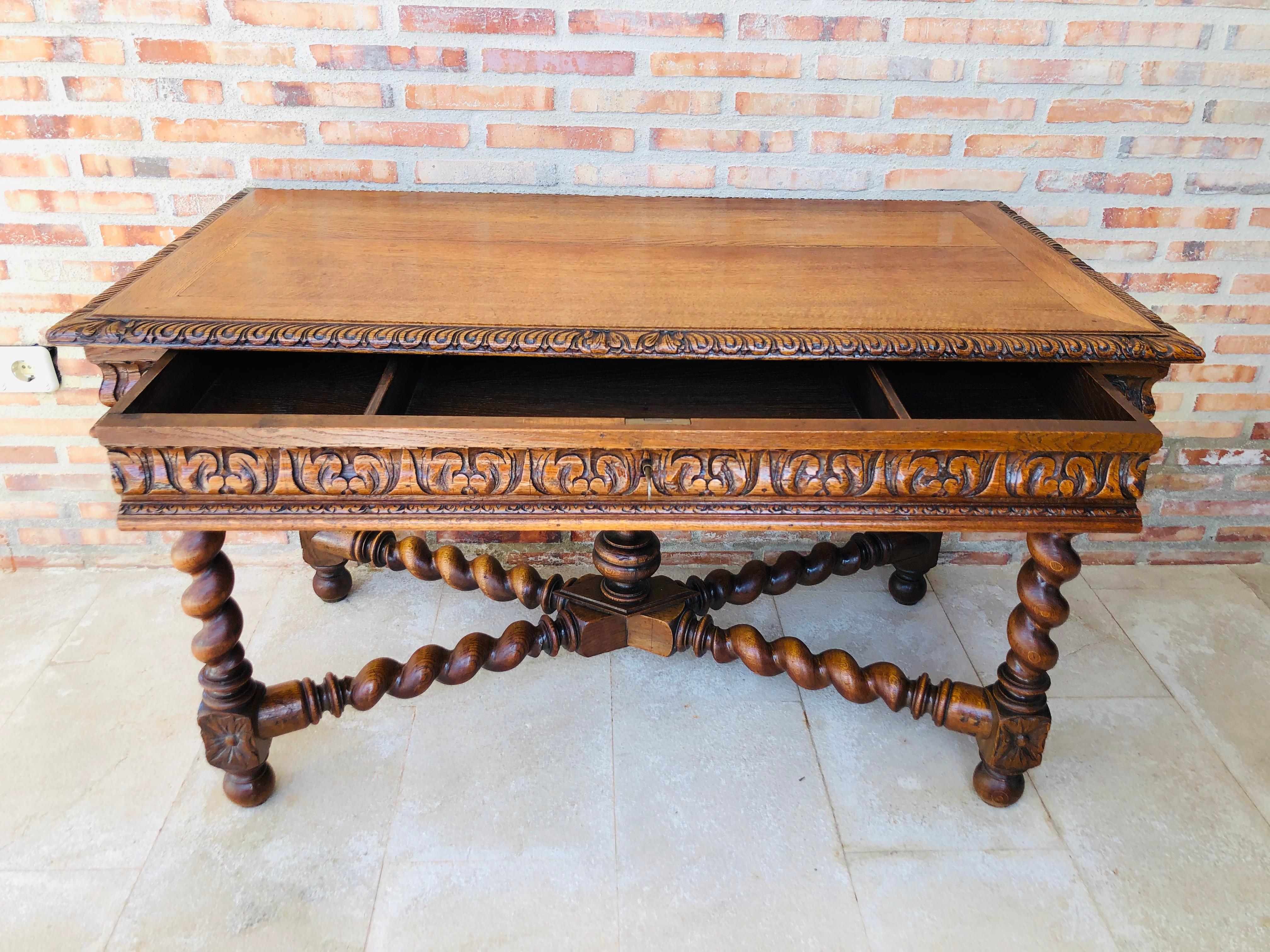 19th century pine and wrought iron desk with three drawers with turning legs
it is carved in back and front.
 