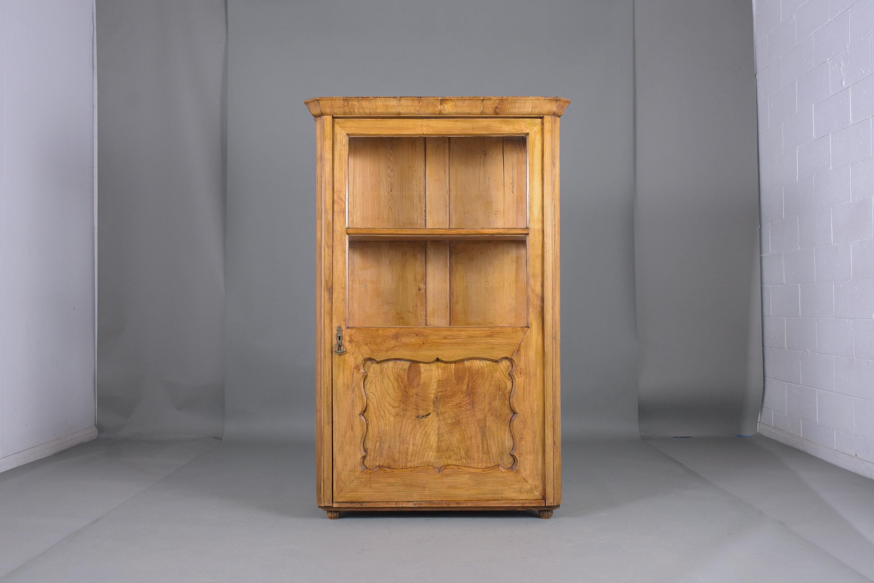 Immerse yourself in the rich history and craftsmanship of our 19th-century Walnut Wood Bookcase, a piece that has been meticulously restored and handcrafted. This exquisite single-door bookcase showcases newly shellacked, waxed, and polished