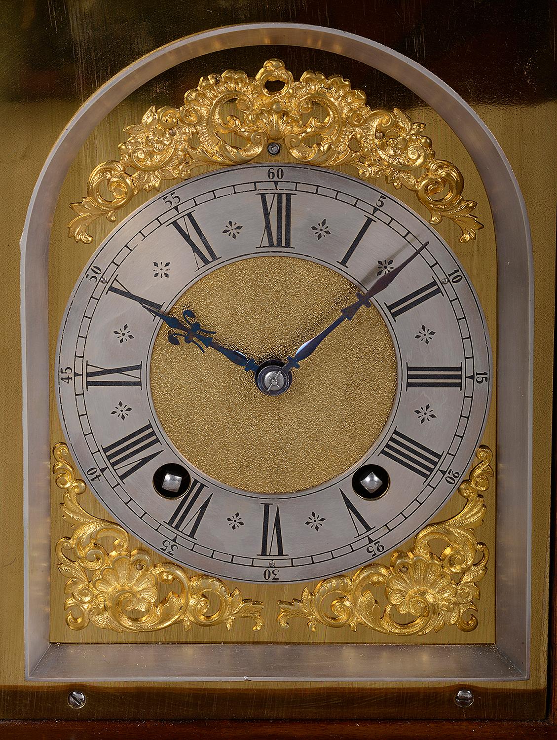 A good quality late 19th century classical English walnut bracket clock. Having gilded ormolu mounts, the brass arched dial with a silvered chapter ring, an eight day duration German movement that strikes on gongs every hour and half hour.