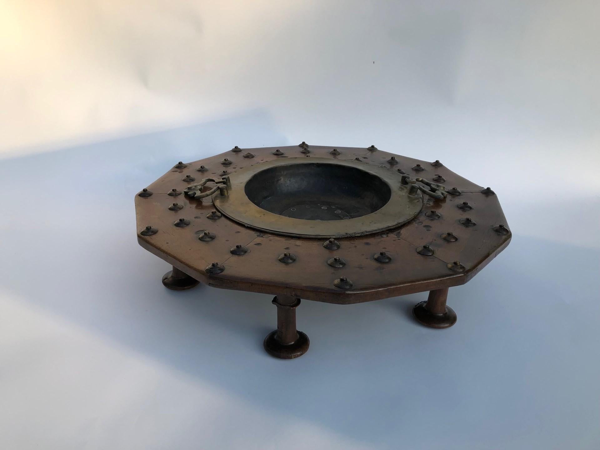 Immerse yourself in the timeless elegance of this antique walnut brazier, a true testament to craftsmanship and sophistication. Crafted from rich, lustrous walnut, the brazier stands proudly on turned legs that exude a classic charm. The wood, aged