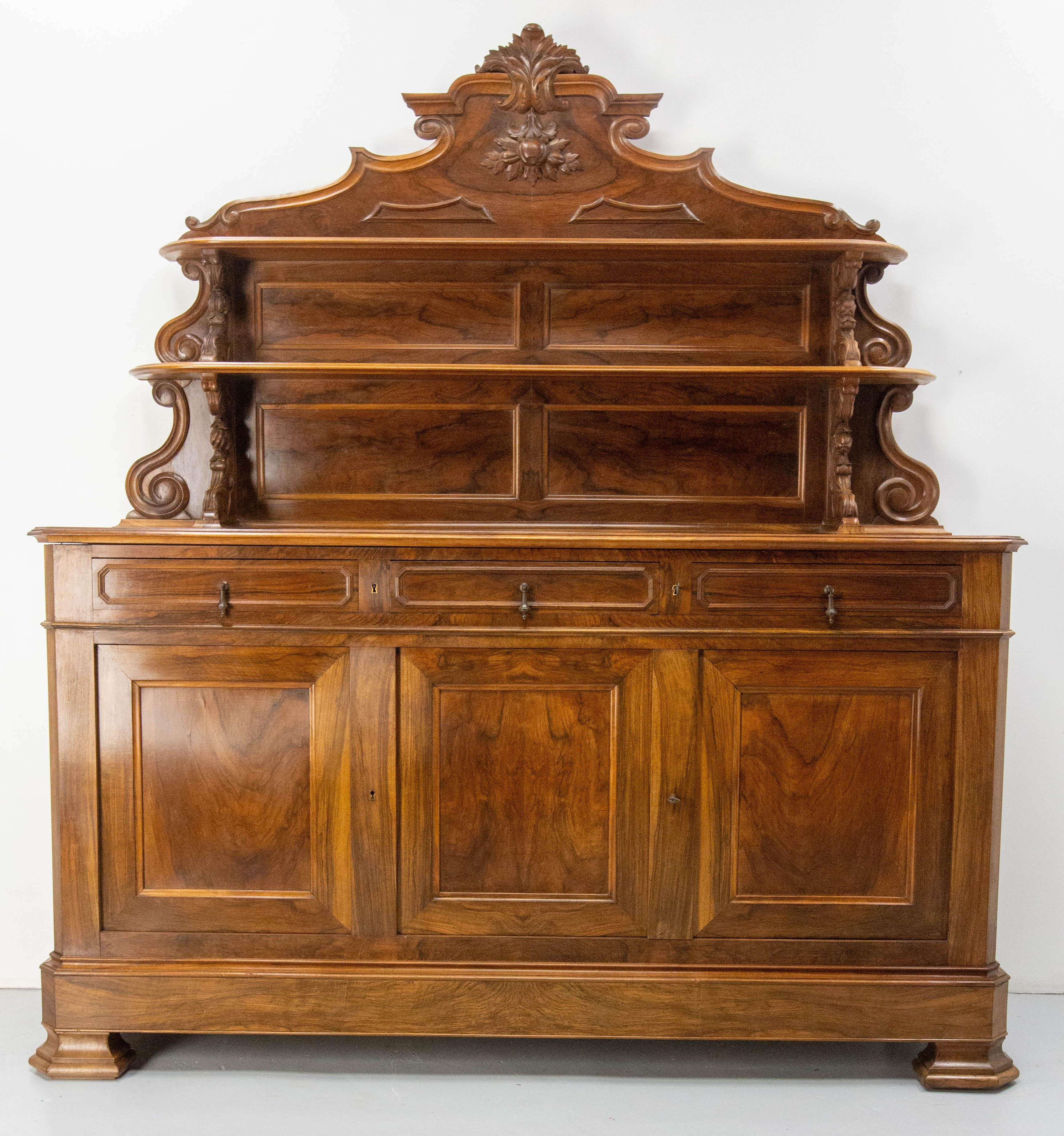 Antique Louis Philippe buffet cabinet,  made circa 1850-1860
This type of buffet was used as the centrepiece of a room. It was used to store tableware in the lower part of the cabinet and to display the finest specimens on the upper shelves. In the