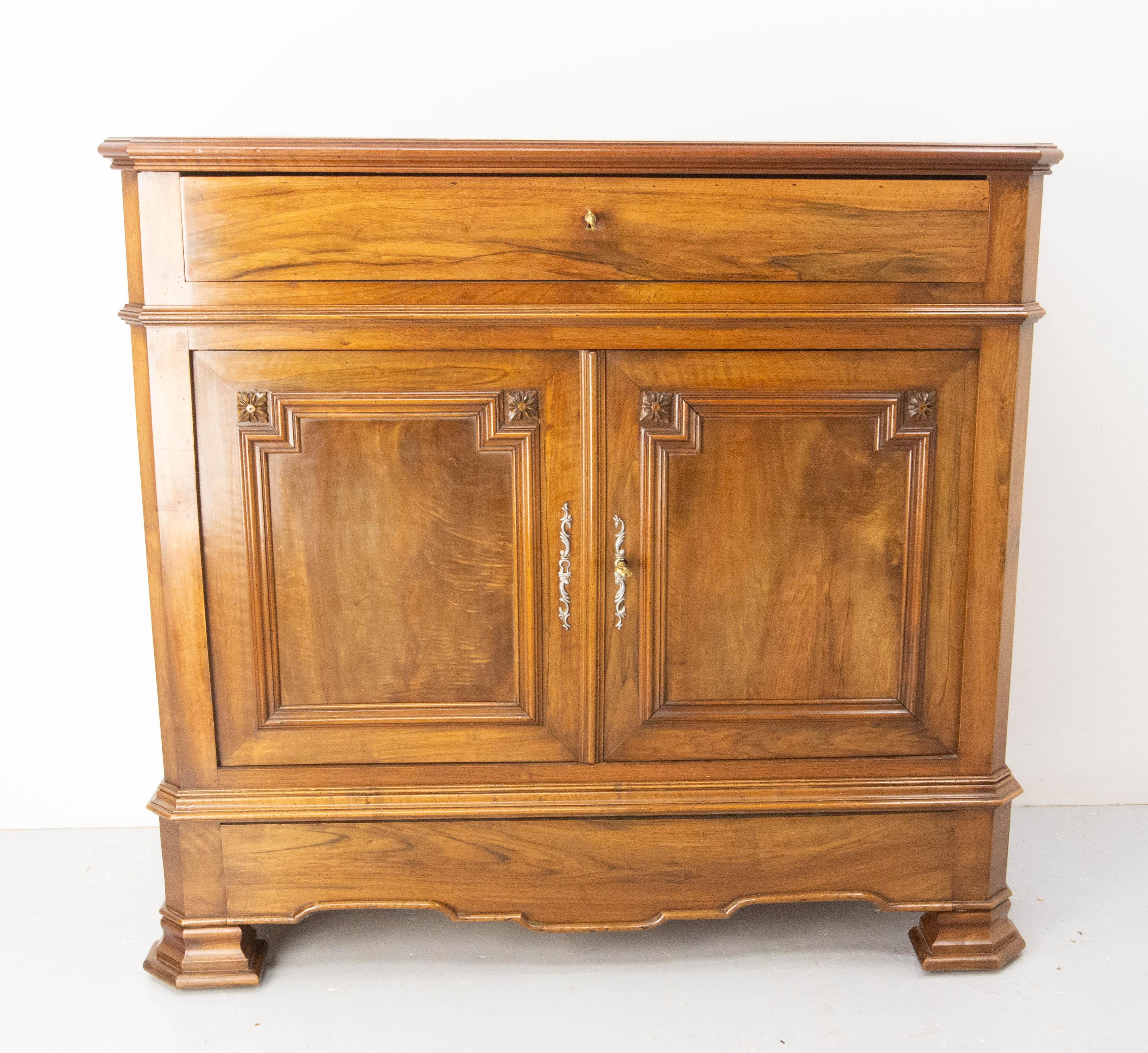 Antique Louis Philippe buffet cabinet,  made circa 1850-1860
This Buffet would be perfect to complete a dressing room with its three shallow drawers. 
The upper drawer is more classical and a secret drawer is hidden in the base of the cabinet.
Good