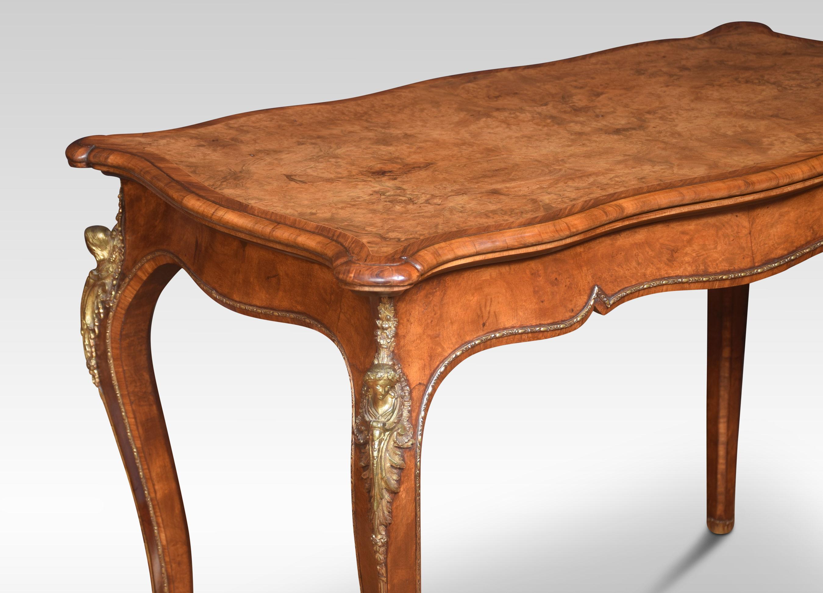 19th century walnut card table, the serpentine well-figured top with ormolu banded border opening to reveal baize interior. All raised up on four slender cabriole supports, terminating in scrolling sabot feet.
Dimensions
Height 28 inches
Width 40