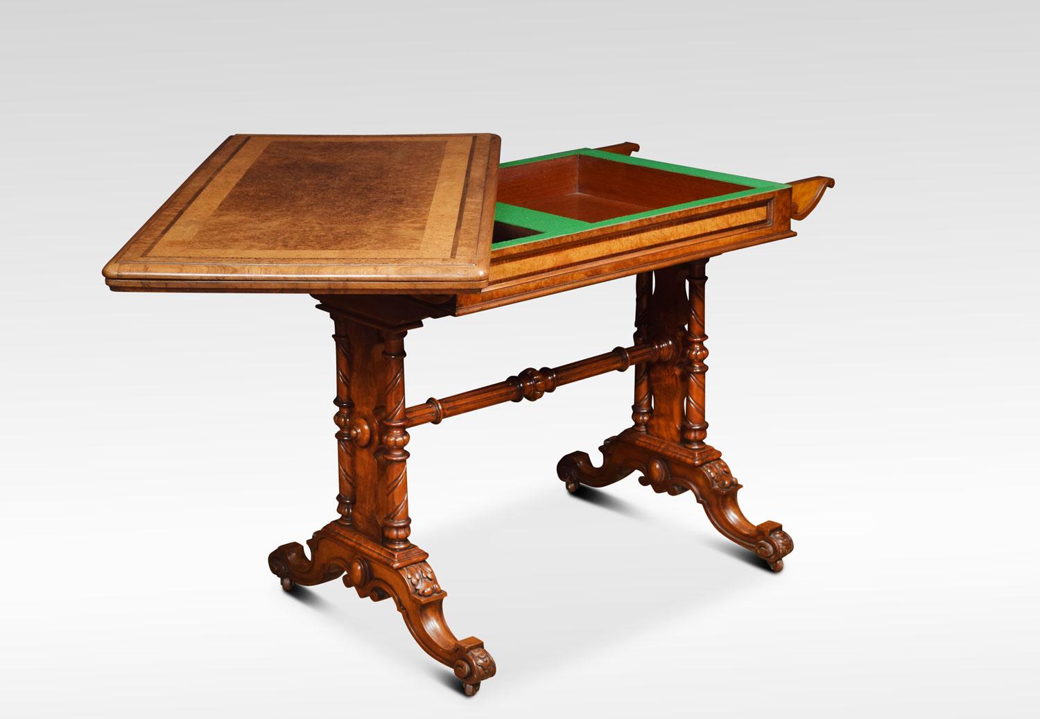 Burr walnut and amboyna card table the folding strung and crossbanded large rectangular top opens to reveal an inset tooled green leather playing surface with unusual brass hinges. All raised up on acanthus carved end supports with lobed leaf carved