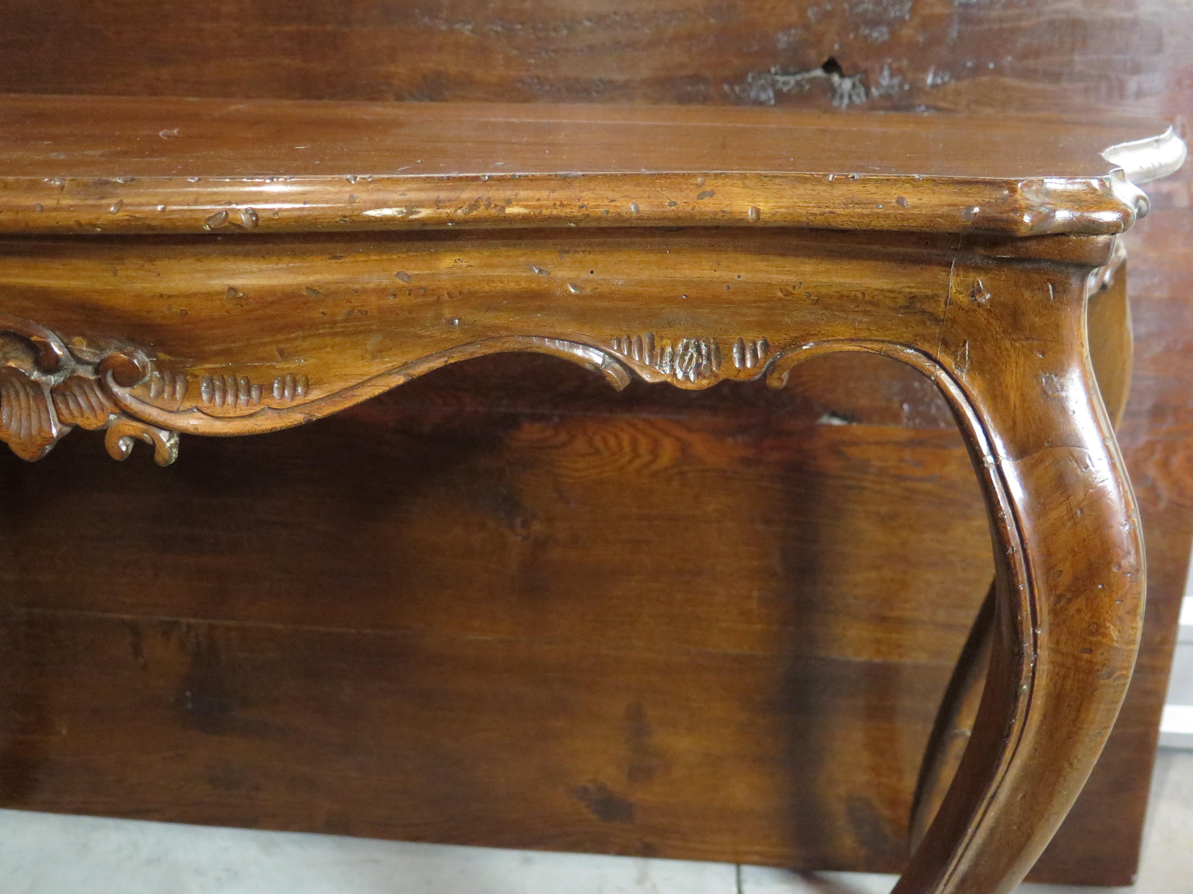 19th century pair of walnut consoles with beautiful finish.