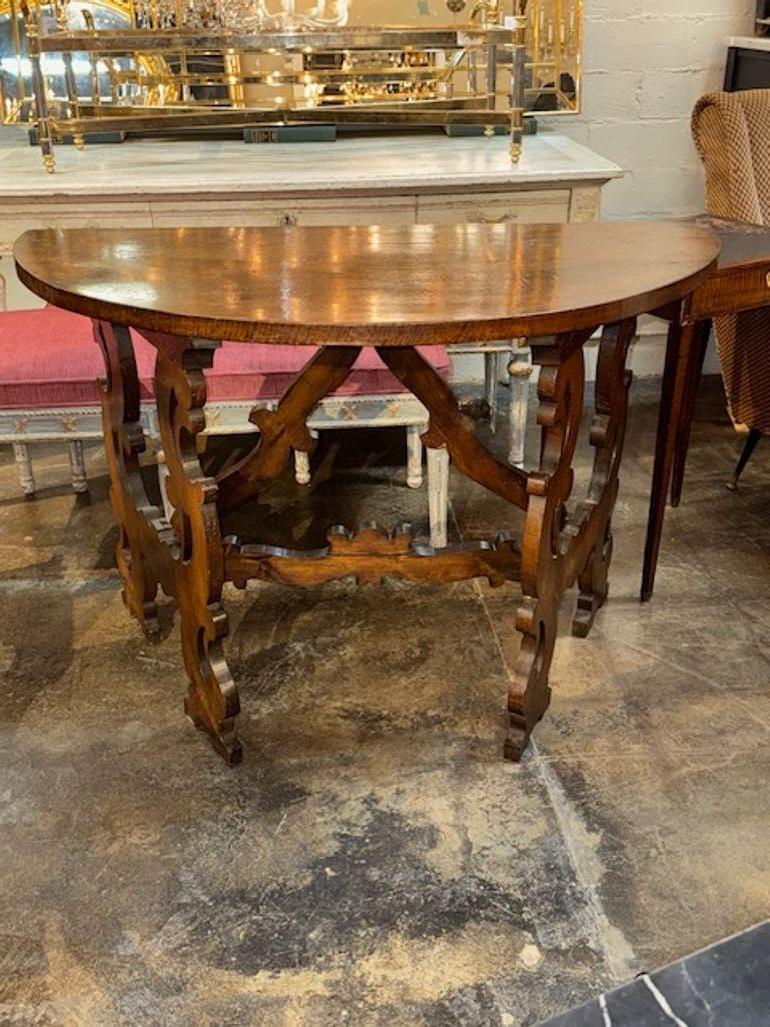 These 19th Century Walnut Consoles from Tuscany are traditional in style and add a touch of elegance to any space. The walnut wood used in these consoles adds warmth and richness to the overall aesthetic, making them a standout feature in any room.