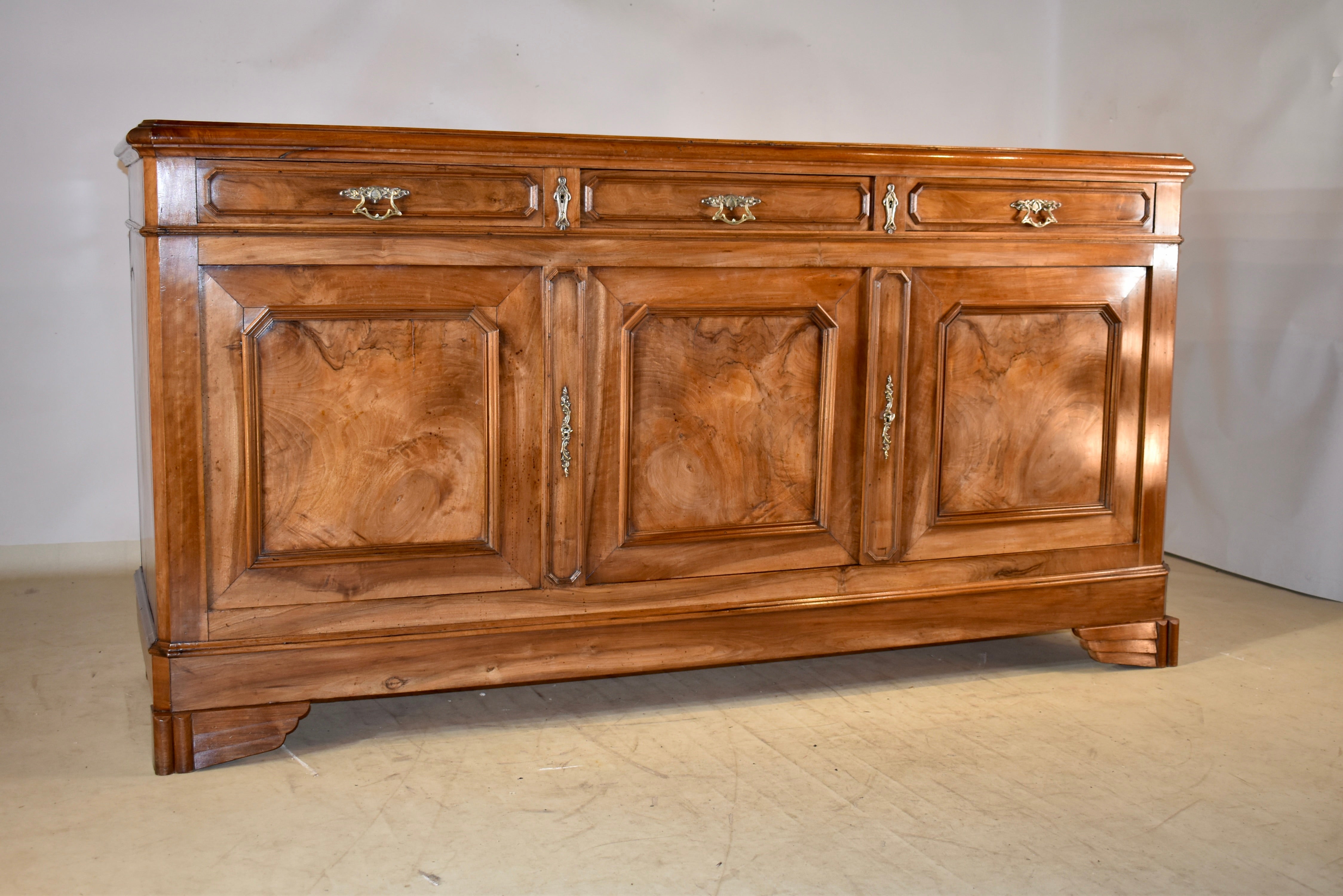 19th century walnut enfilade from France.  This entire piece is made from the most exquisitely grained and burl walnut timber we have had the pleasure to see!  The top is miraculously figured and makes a statement all by itself.  The top has beveled