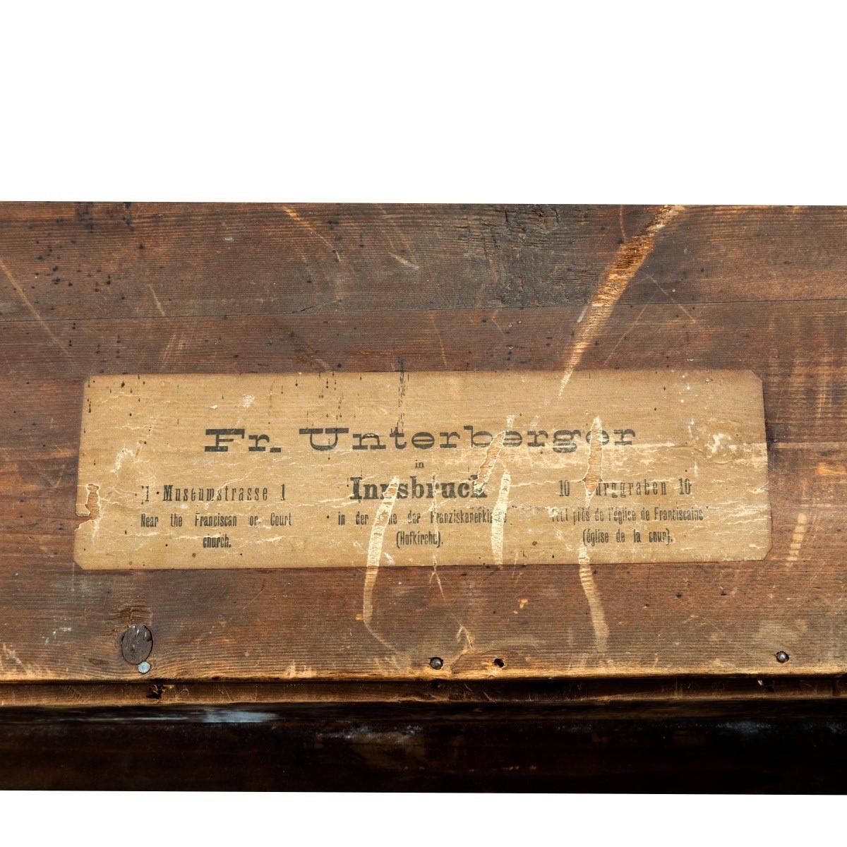 A large and superb quality walnut-framed Tyrolean lime-wood carving, showing a scene from the life of Speckbacher in which his 12 year old son volunteers to fight for his country in 1809, the reverse with 2 paper labels one with full historical