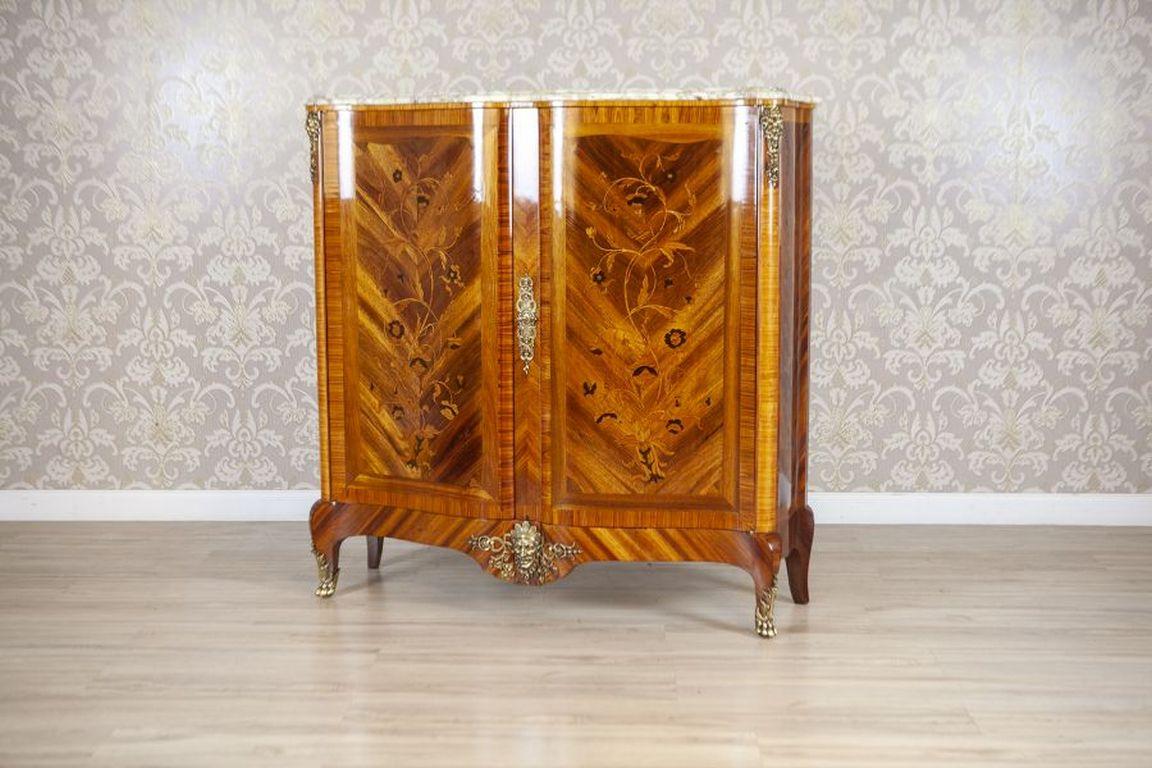 19th-Century Baroque Revival French Walnut Commode With Marble Top

This late 19th-century piece is a two-door commode with a marble top. The concave-convex shaped fronts of the doors feature a white marble top with a profiled edge. The surfaces of