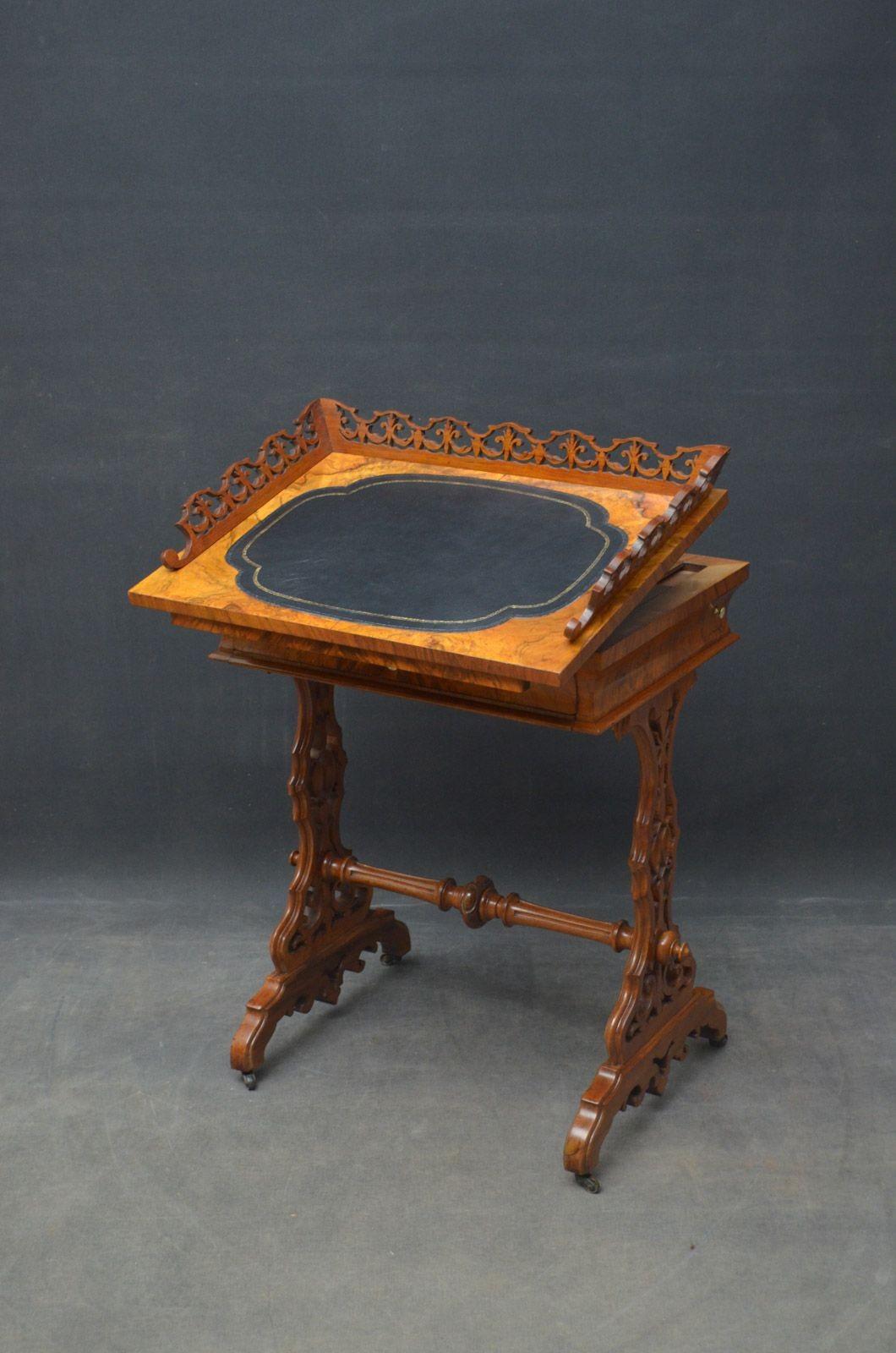 Sn4628 Unusual 19th century figured walnut writing table with side drawer, having fretwork gallery and leather writing surface to the top, above a concave drawer and chess and backgammon board, standing on finely carved supports united by turned