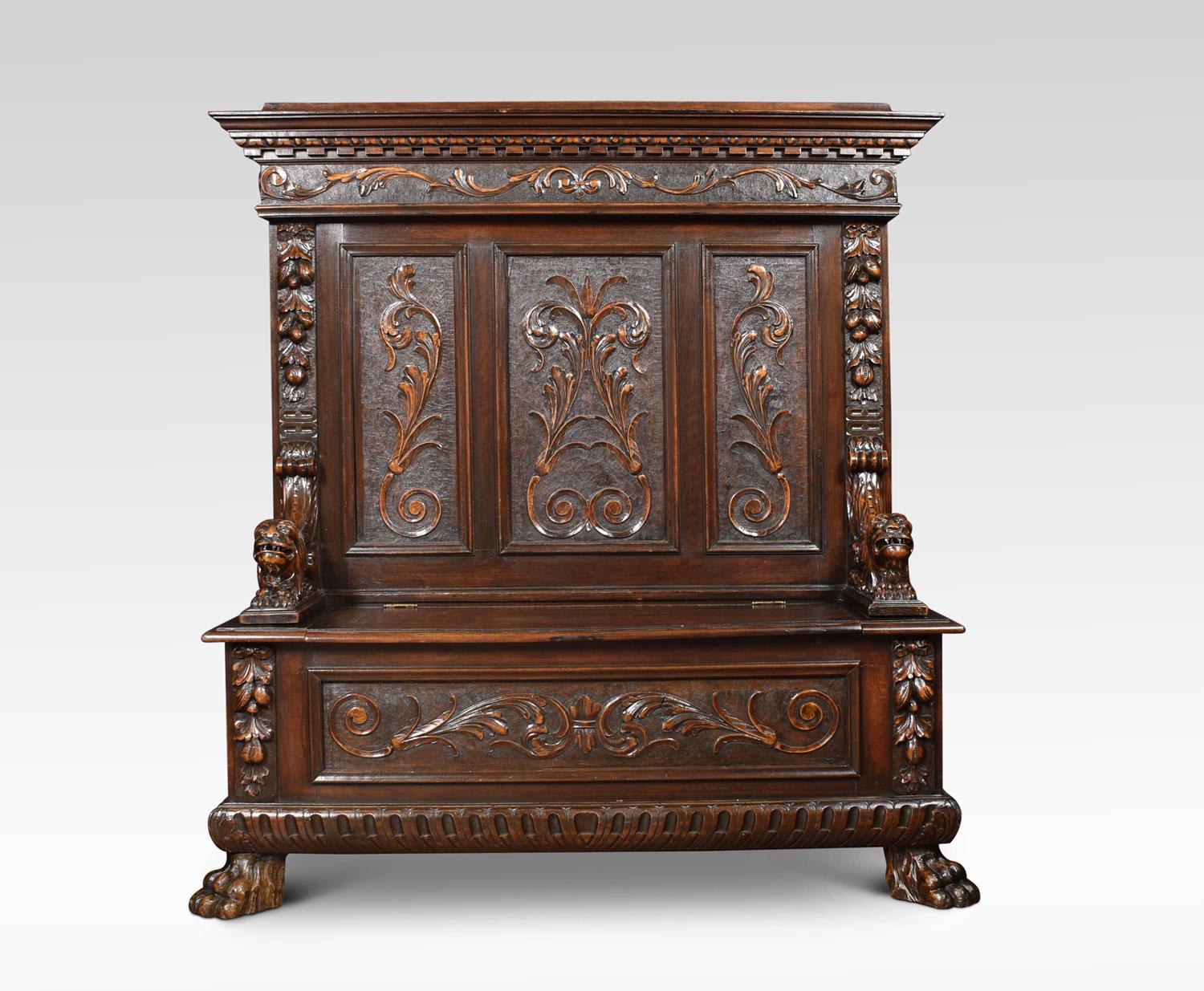 19th century walnut hall settle the three-panel back with a moulded dentil cornice and fruiting traceries. Above lion monopodia arms enclosing the box seat opening to reveal large storage area. All raised up on bold paw feet.
Dimensions:
Height 59