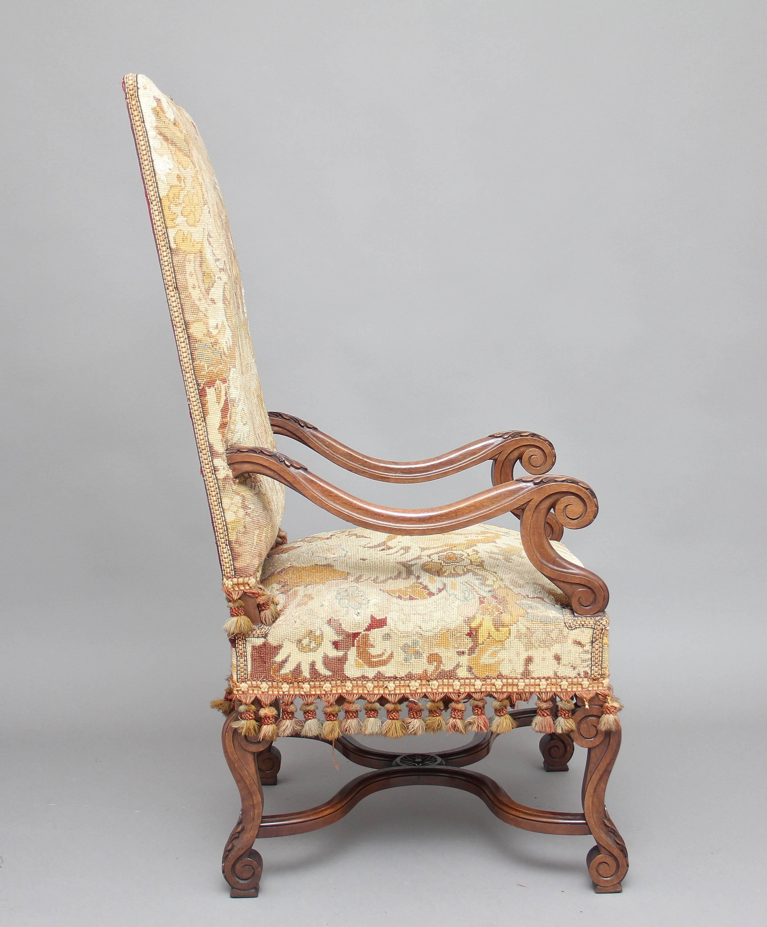 19th century French walnut high back open armchair, original tapestry upholstery of a French country side scene, shaped and carved arms with acanthus leaf decoration, supported on elegant shaped legs with carved scroll feet united by a shaped