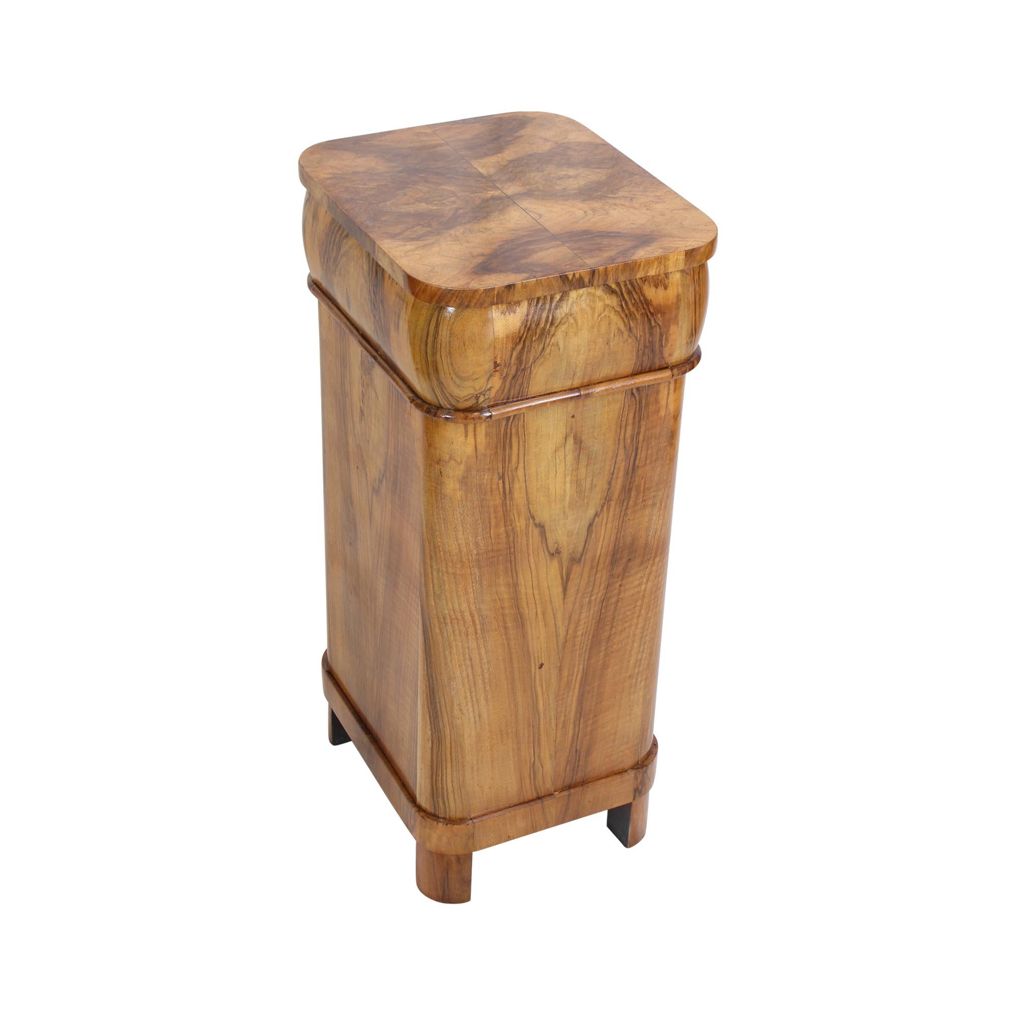 Beautiful Biedermeier walnut veneer bedside table or column cabinet from Germany. All around with very nice walnut veneer and a beautiful veneer picture. The opening handles are made of brass. There is a drawer at the top and a door at the bottom.