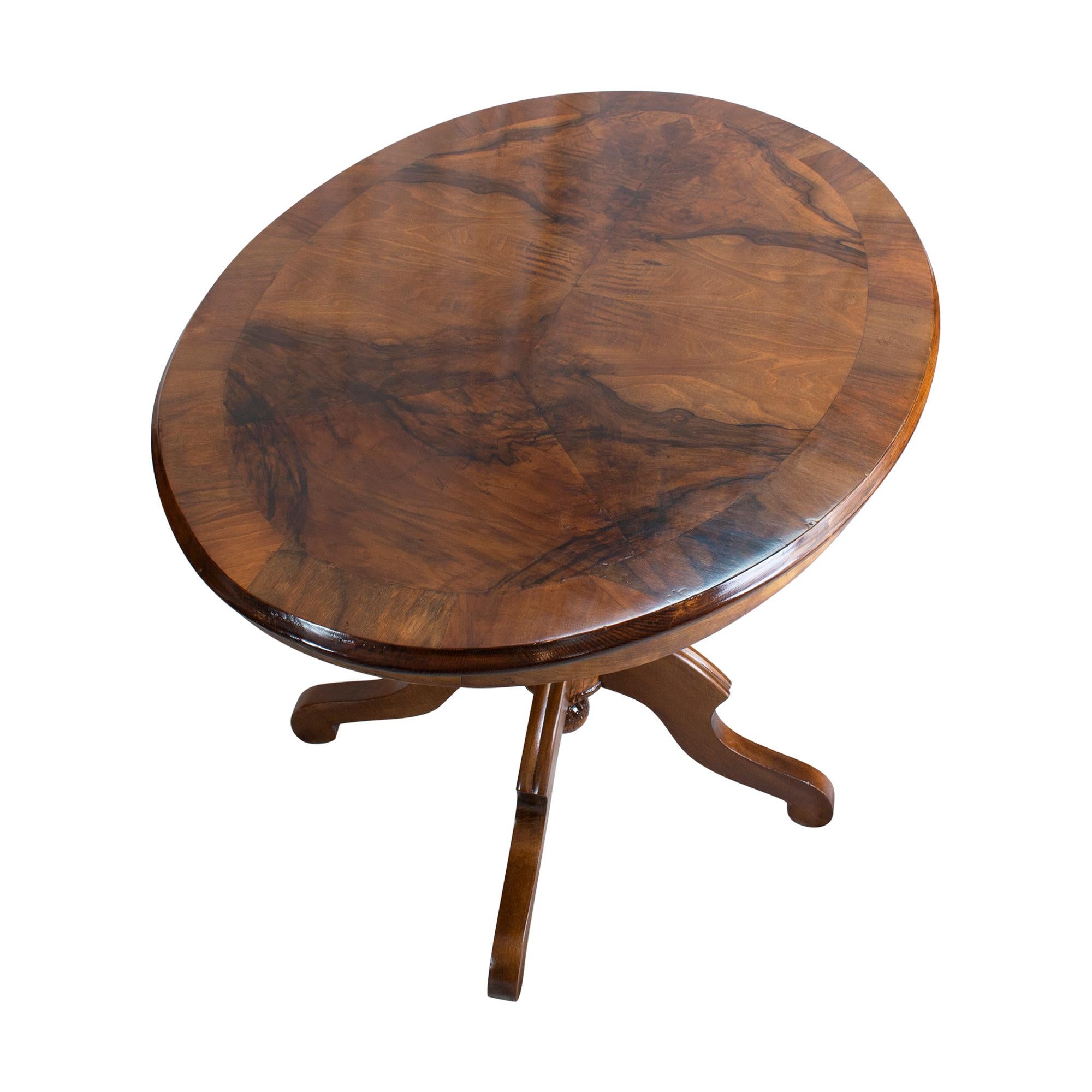Antique Oval Walnut Veneer Table
Experience the allure of the Historismus era with this exquisite antique oval table. Crafted with stunning walnut veneer, its timeless elegance adds warmth and sophistication to any room. The detachable top offers