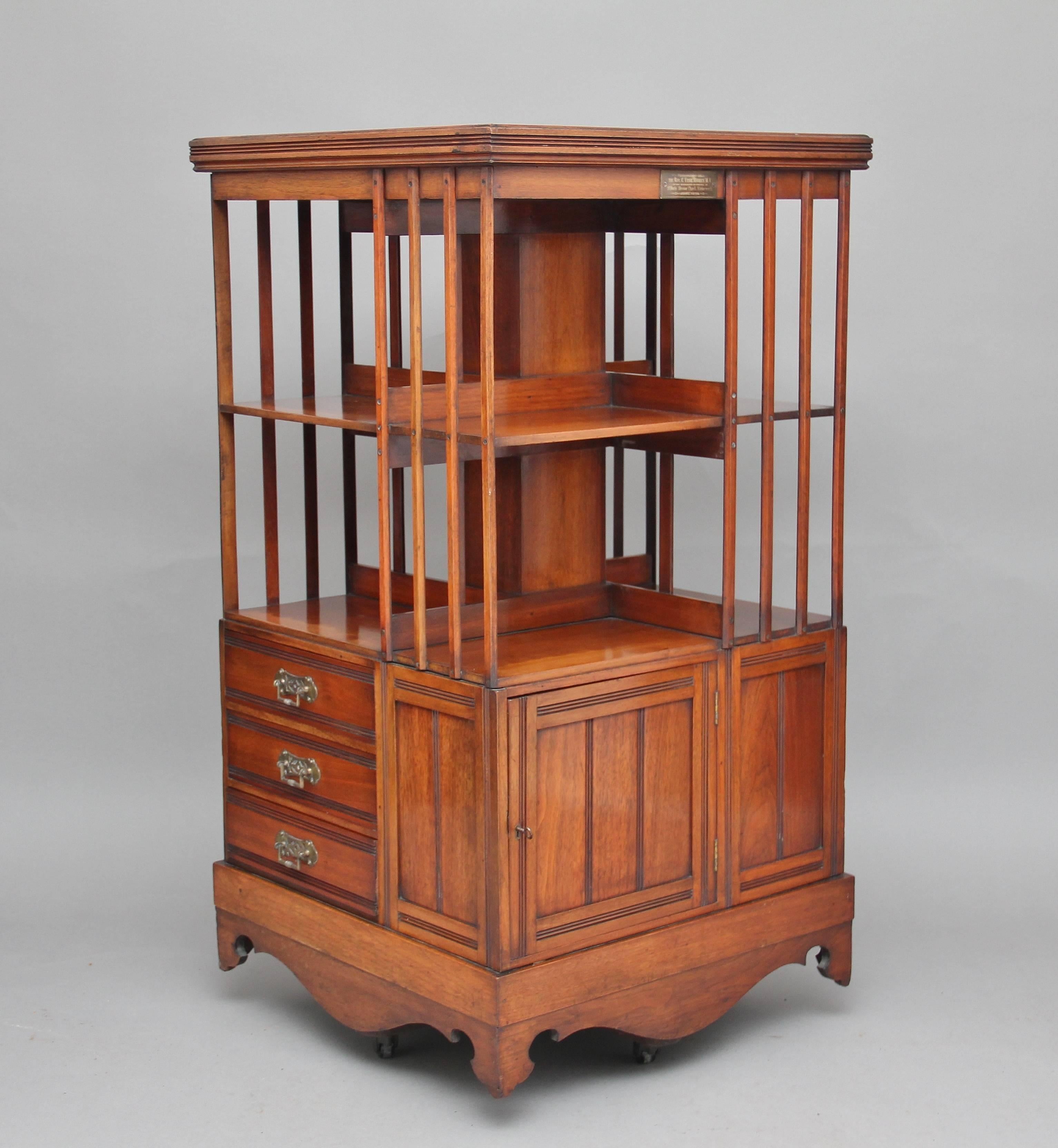 A very unusual and good quality revolving bookcase in walnut, with eight sections for books, then on two sides you have three oak lined drawers each side then alternate you have cupboards, the whole thing mounted on original castors, this lovely