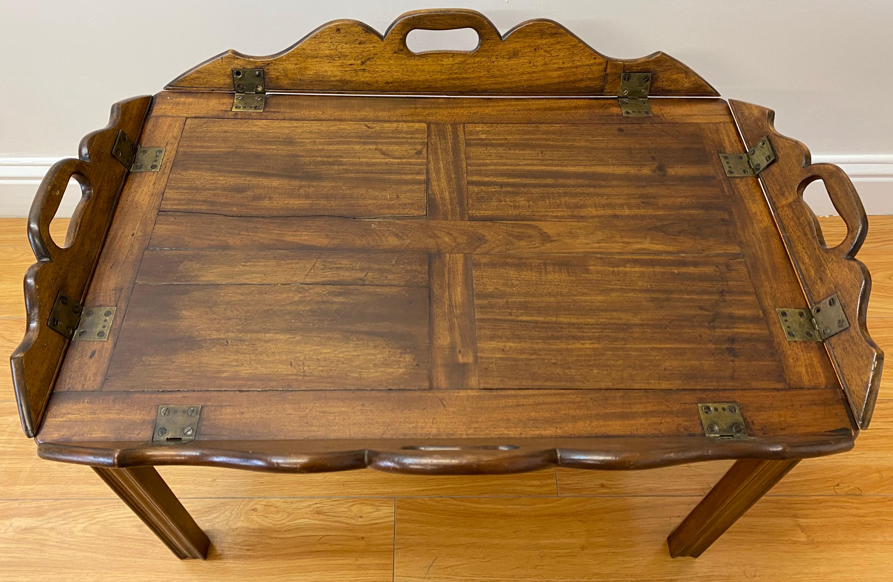 19th century walnut serving tray on stand

Serving tray with handles on four sides

The sides of table drop down to make a larger surface, great for coffee table too!

Measures: 26.25