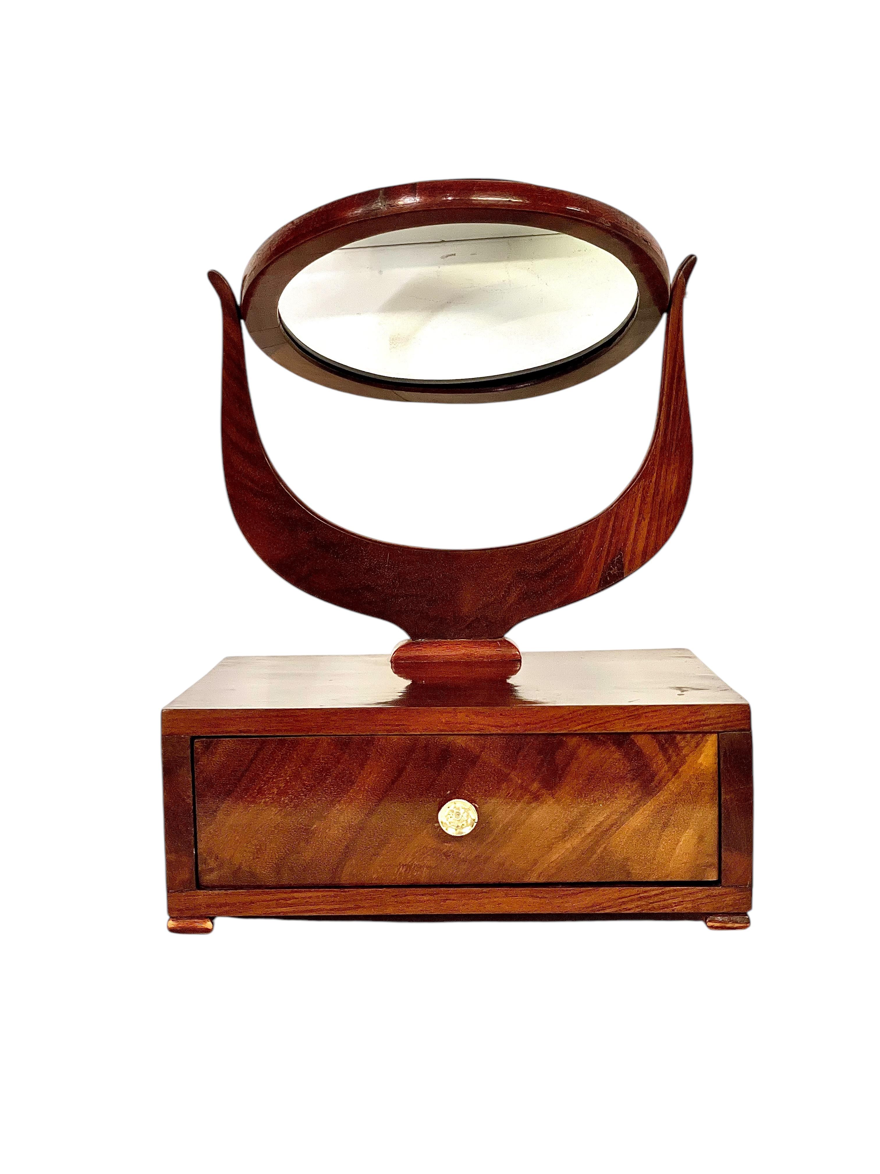 This exquisite petite dressing table mirror dates back to the French Restoration period (circa 1815–1830) and is crafted from fine walnut, showcasing its rich, warm tones and elegant grain patterns. Its design reflects the refined simplicity