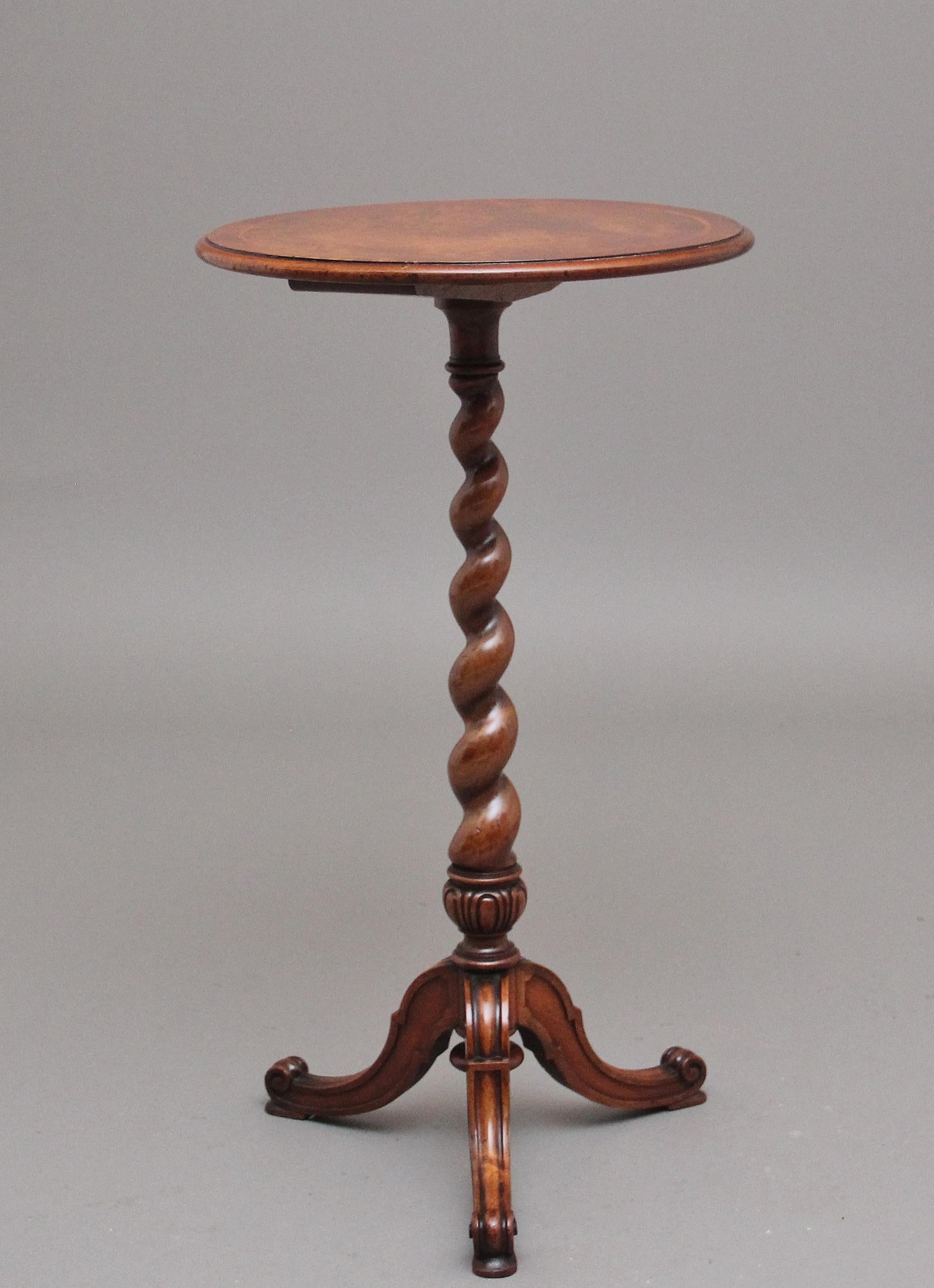 19th Century walnut wine / occasional table stamped Holland & Son.  Having a wonderful figured and inlaid circular top raised on a barley twist column with carved decoration at the bottom and supported on three cabriole legs terminating on scroll