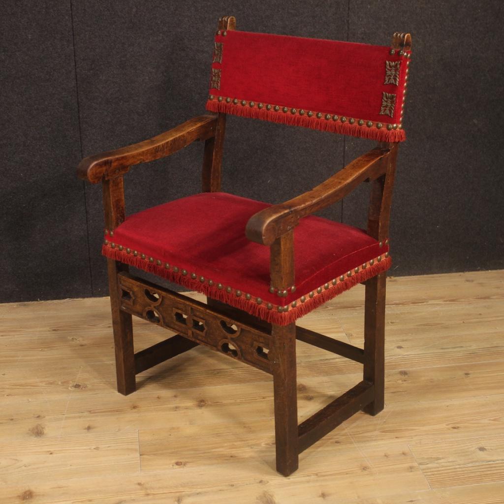Antique Italian armchair from the early 19th century. Furniture carved in walnut covered in non-original fabric, replaced during the 20th century. Representation armchair, for living room or study, of pleasant decor. Padding in good condition.