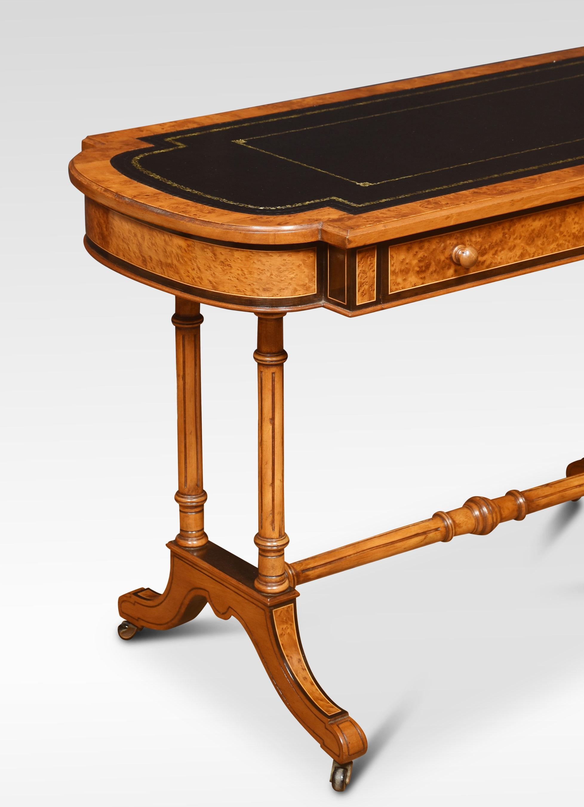 19th Century walnut library table, the large rectangular top with rounded ends having tooled inset leather writing surface. The frieze is fitted with long drawer supported on twin carved uprights. All raised up on cabriole legs united by