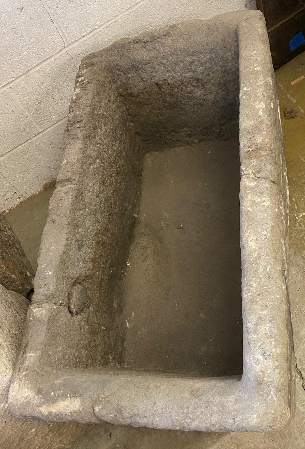 This 19th century Guatemalan Large Scale Bebedero, water trough, is one solid piece of stone. It is long and the sides are tall. There is one area that is a long ago repair where a circle of old stone has been inserted and sealed. It add to the