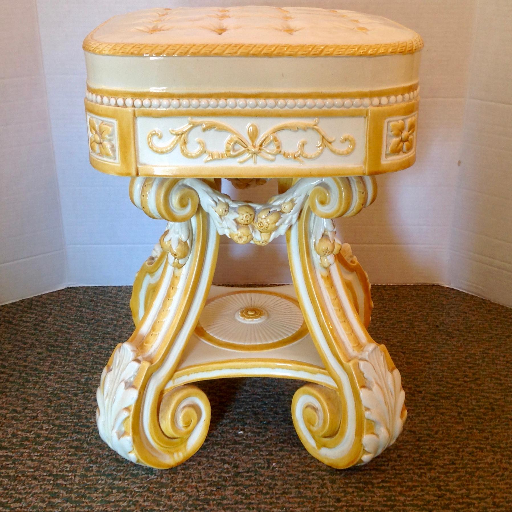 Rare and superb garden seat form - fashioned with a cushion like top raised upon scroll form legs. A truly superior garden seat. Beautiful yellow cream glaze.