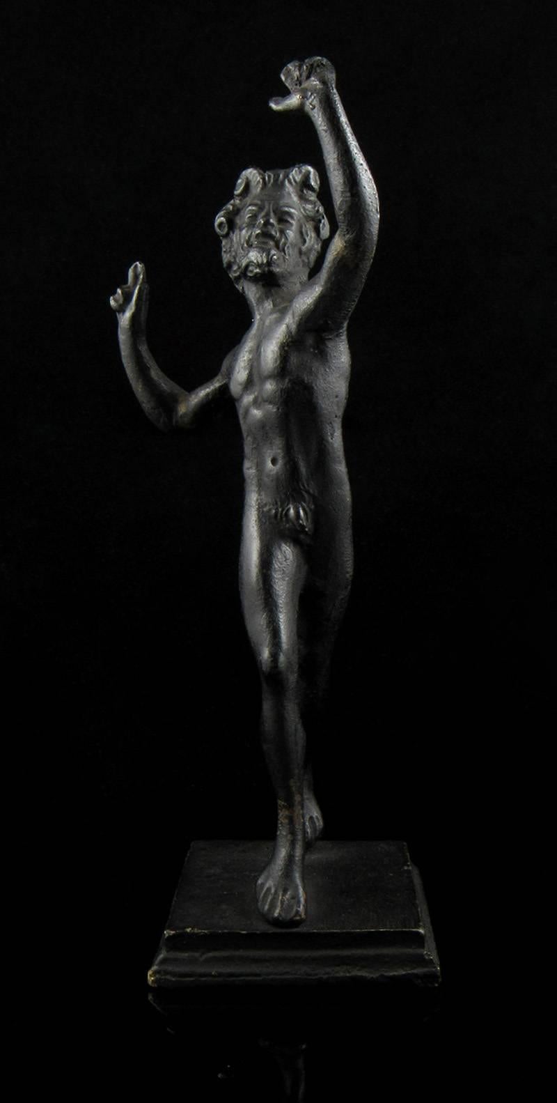 A small and heavy well cast bronze of the dancing faun - the life size statue excavated at Pompeii in 1830 following its discovery in the ruins of one of the most opulent Roman homes in the city. 

A very good and faithful copy in solid bronze,