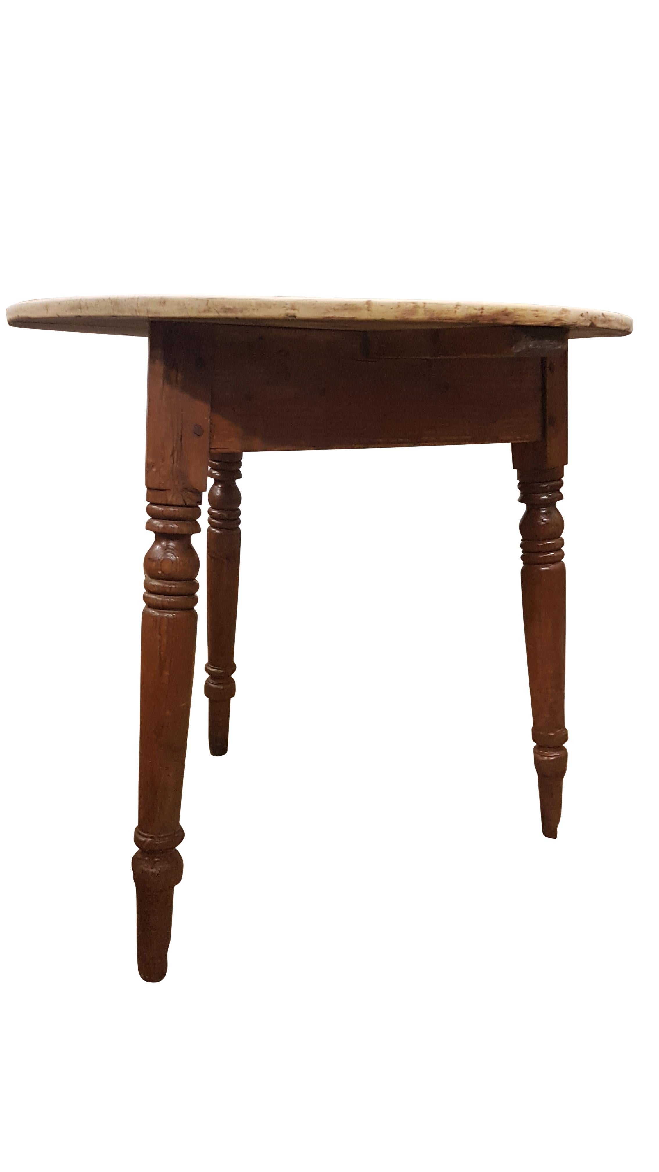 A very nice 19th century pine cricket table from an old farmhouse in Montgomeryshire in Wales.
The peg jointed turned legs have lovely wear to them and a great color, the top is a pale raw scrub top. The table sits nicely with good presence standing