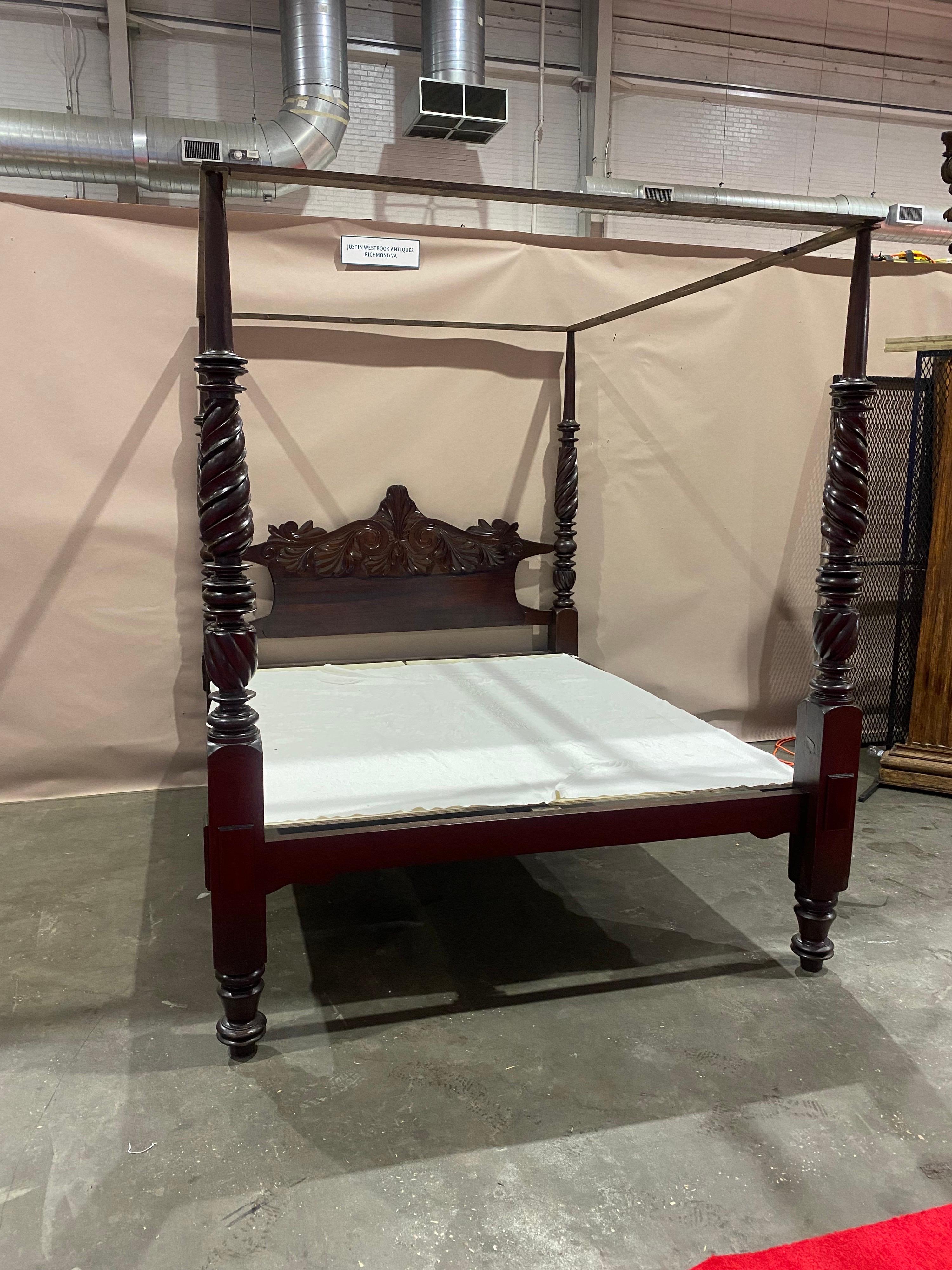 Impressive 19th century West Indies carved mahogany 4 post bed professionally restored and converted to fit a California king mattress. 

Though we like stretching beds to California kings to help with the proportions of the headboard, they can be