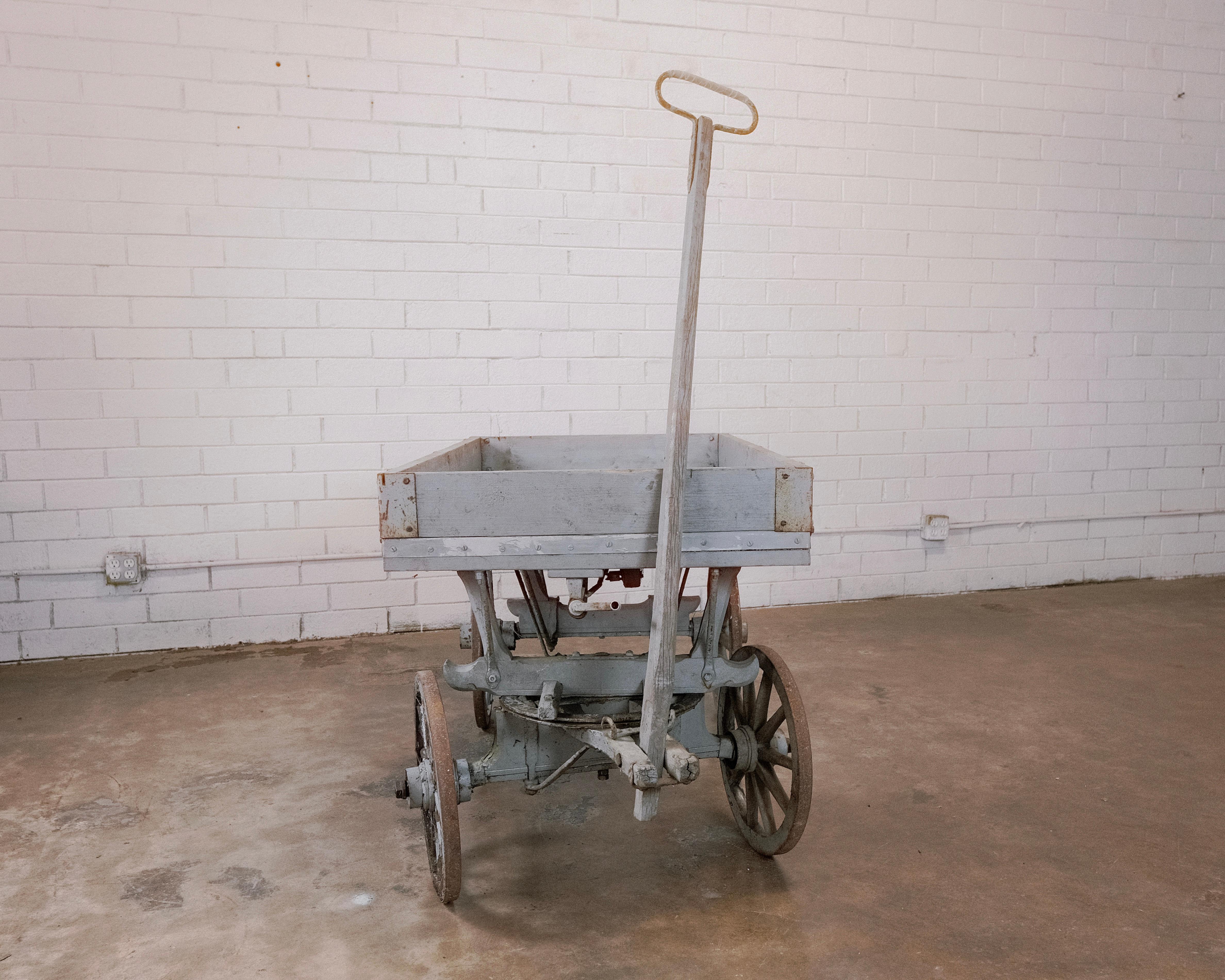 Step back in time with this charming Wheeled Hand Cart, a delightful relic from the 19th century. Crafted with rugged practicality in mind, this cart features sturdy wooden construction and the addition of wheels for added mobility, making it a