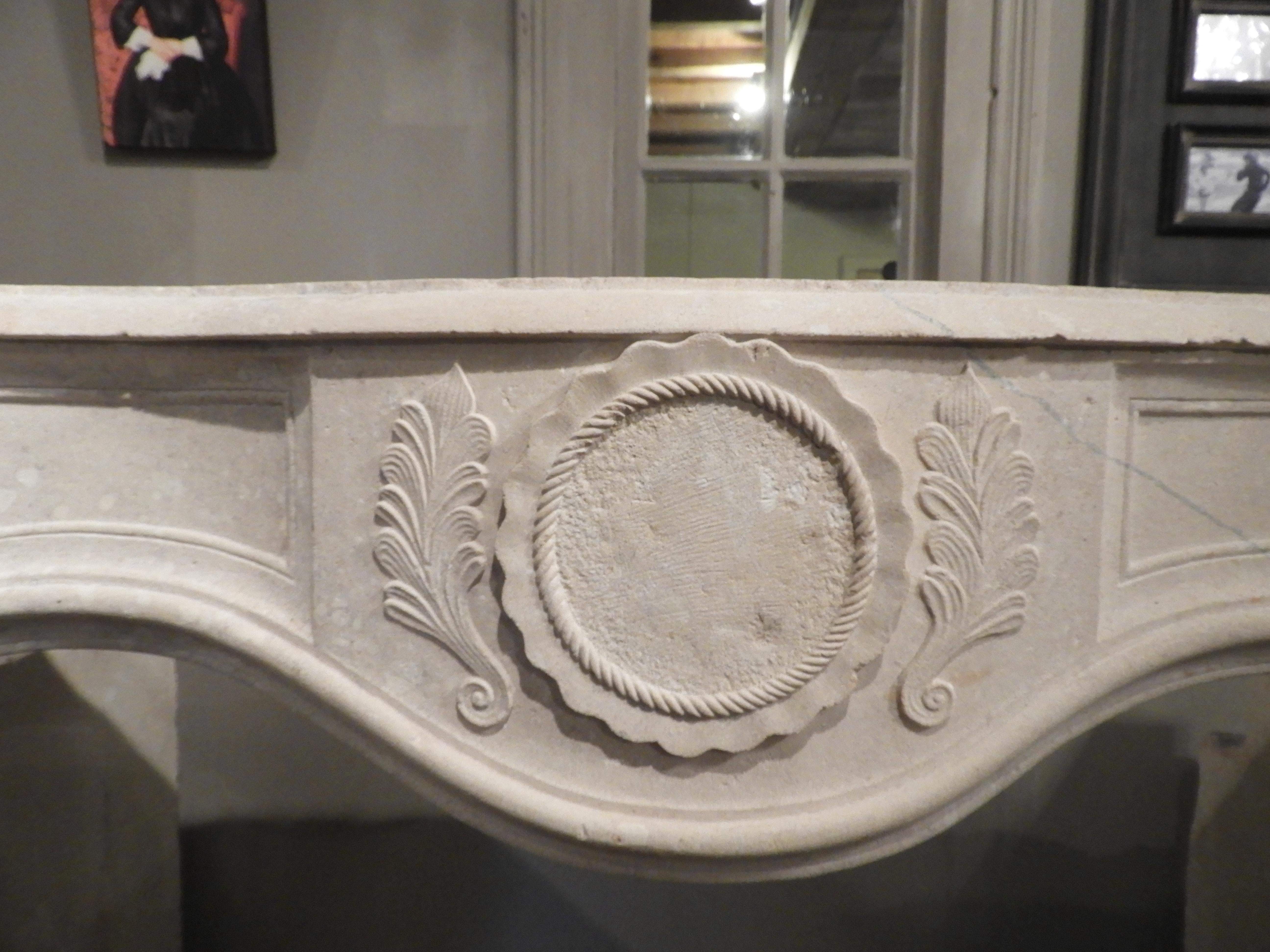 19th French limestone Louis XV fireplace with an interior size of 139 cm wide x 130 cm high.
