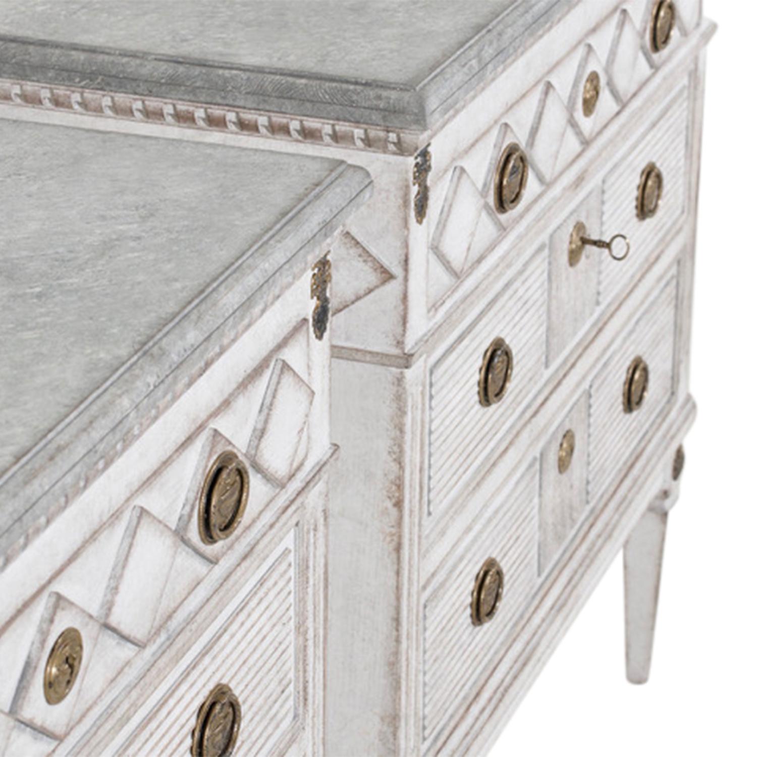 A 19th century, white-grey antique Swedish Gustavian pair of chests made of handcrafted painted Pinewood with two large drawers and one small one, in good condition. The Scandinavian cabinets, cupboards are composed with a light-blue, grey top