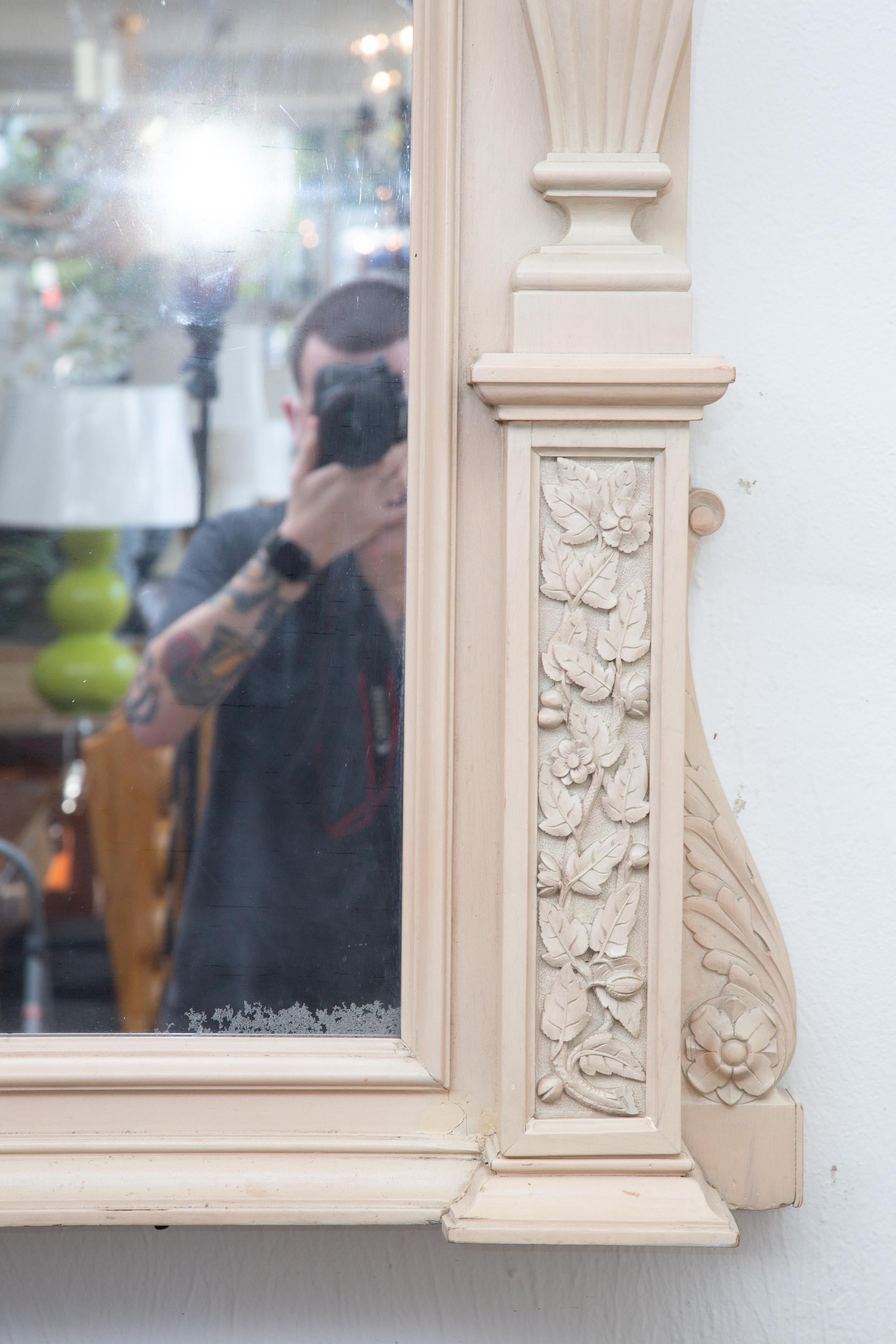 This is a spectacular late 19th century American wall mirror. The mirror has been updated by the removal of the 'crazed' finish; and the application of a 'limed' and glazed finish.