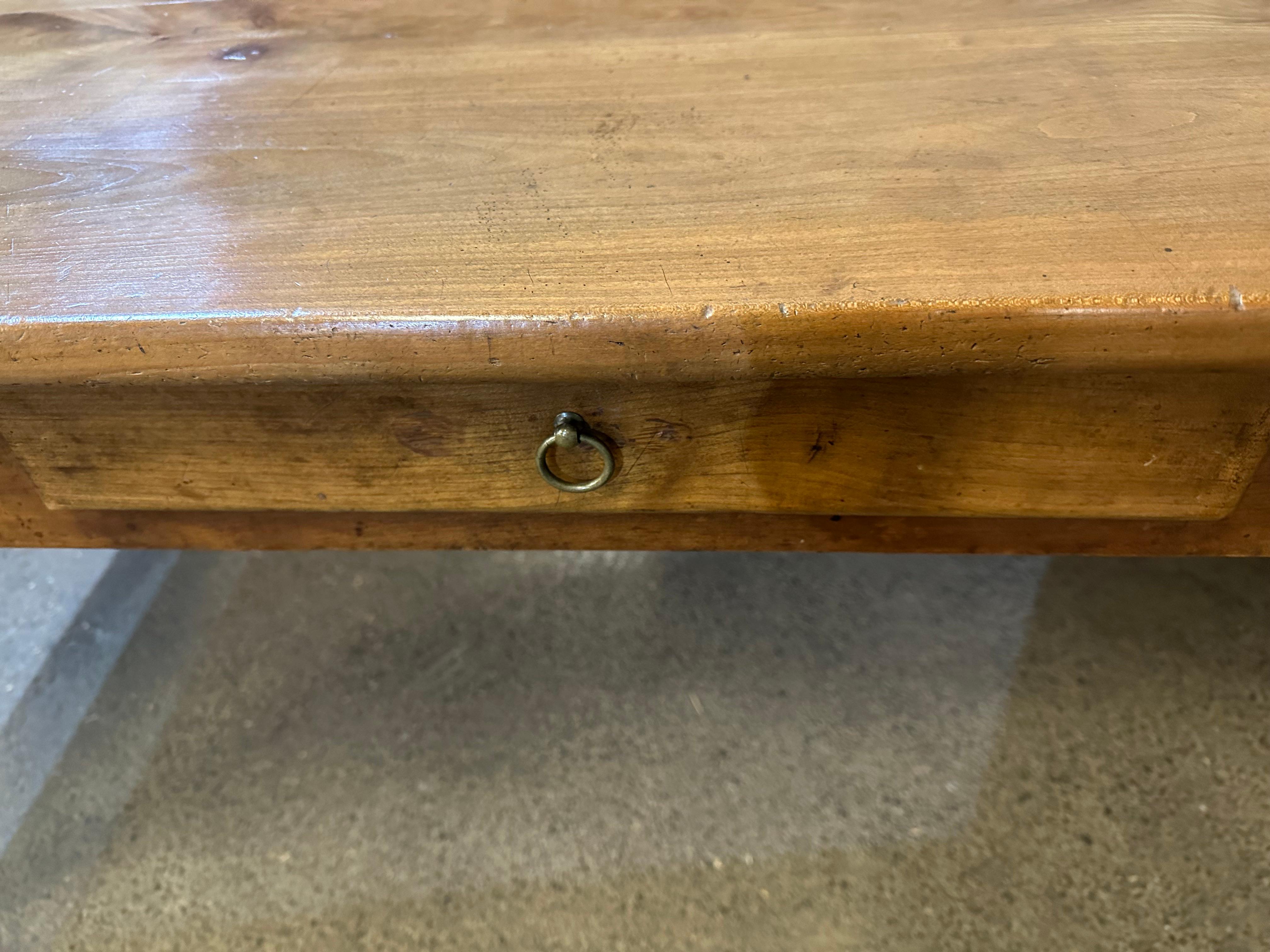 19th century wide cherry dining table with one side drawer. The table sits on a sturdy cherry base with four tapered legs. The beautiful cherry top is a glorious pale cherry colour. This is an exceptional wide cherry table. Gorgeous patination and
