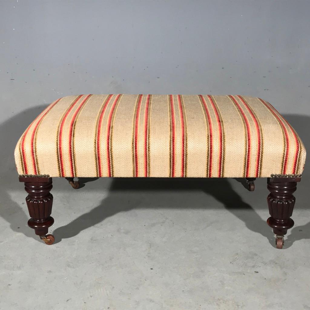 Fantastic William IV centre stool or footstool.
Lovely stocky sized turned and carved legs with their original castors.
Fully refurbished internally and re upholstered in this stripe to give it a fresh and contemporary finish.
The stool is the