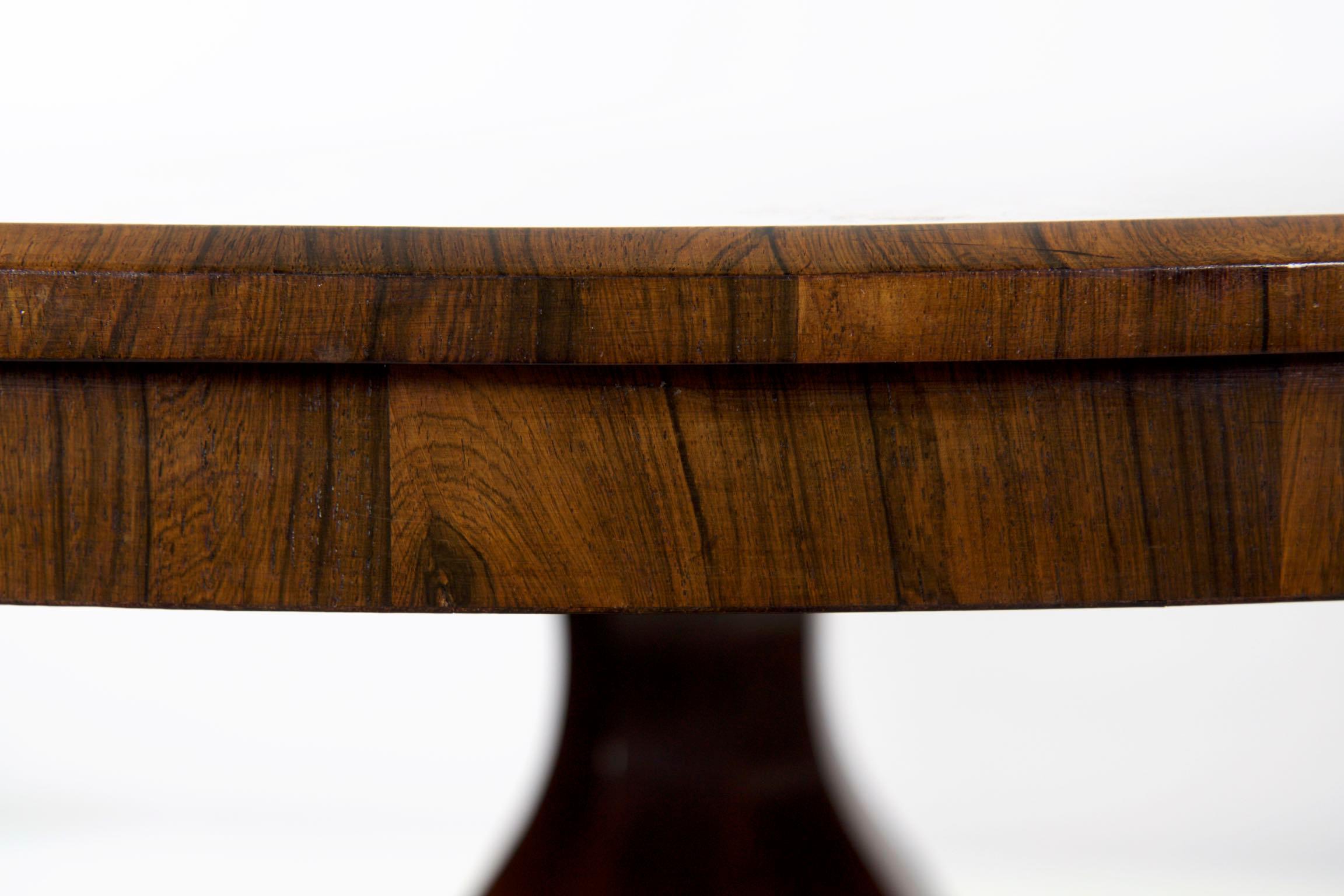 An exceptional William IV rosewood circular dining table
London, circa 1830

This superior circular dining table is crafted of the finest grade of materials throughout. A product of the William IV period, the table was likely crafted in London