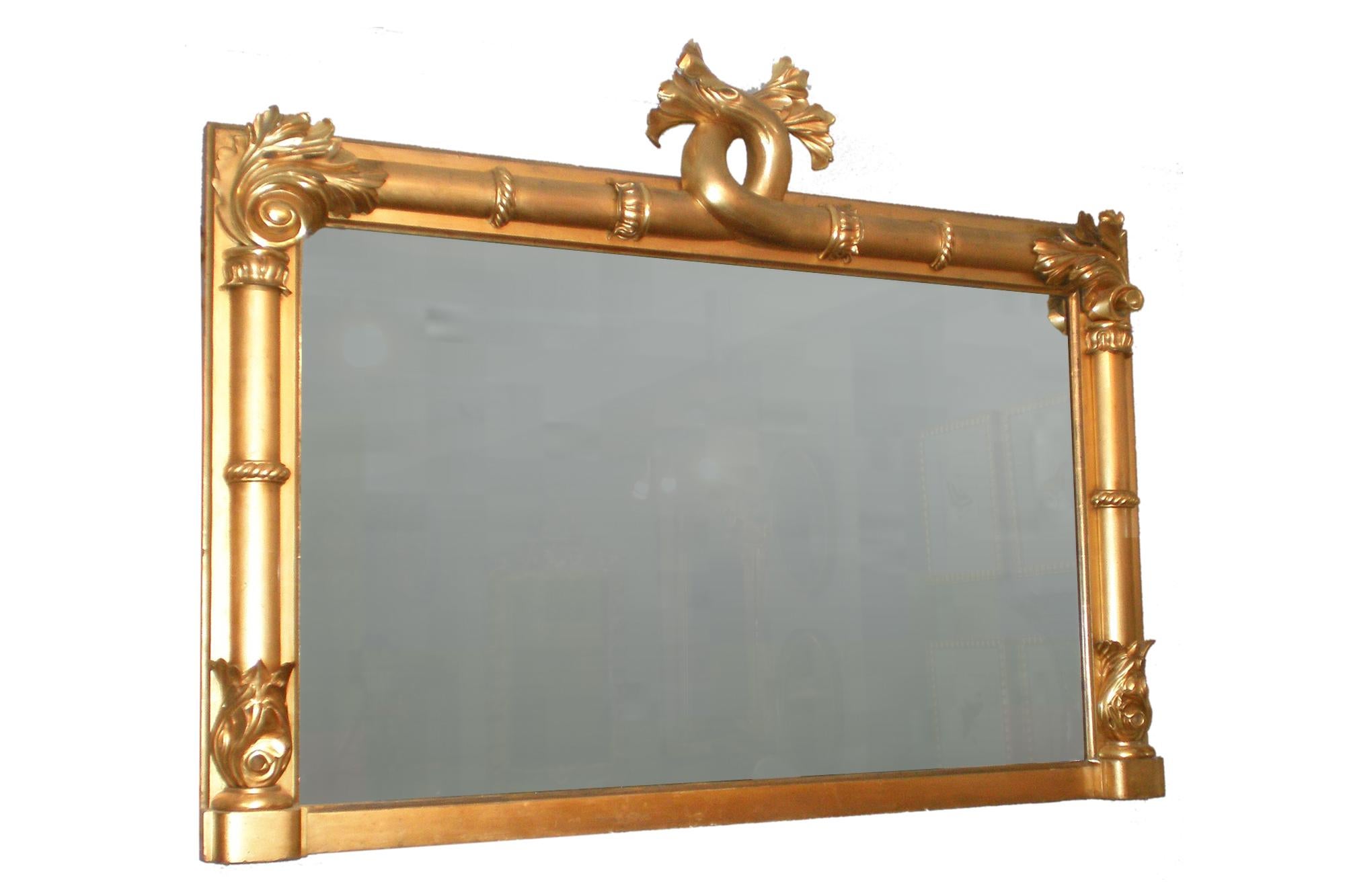 19th Century William IV English large rectangular ornamental mirror. The sides and upper edge within half columns with lotus and acanthus carving, with interlinked acanthus leaf crest above.