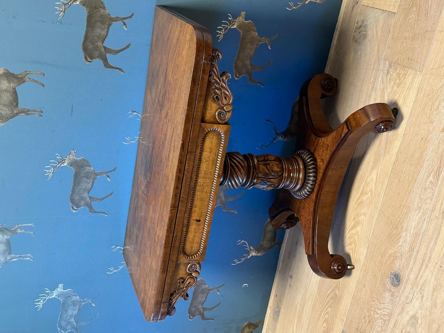 Antique walnut play table. In good original condition Can be used as a wall table and can be folded out to a play table. Beautiful stylish column leg. Beautiful patina.

Origin: England
Period: Approx. 1830
Dimensions: 91cm x 45cm x h.70cm  (91cm x