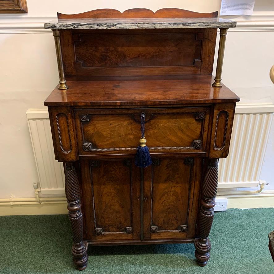 Unusual and lovely quality William IV mahogany chiffonier, circa 1830.
This piece has two hidden document slide drawers on the front corners as you can see if the photos and a deep central drawer too. Below there is the two-door cupboard space
