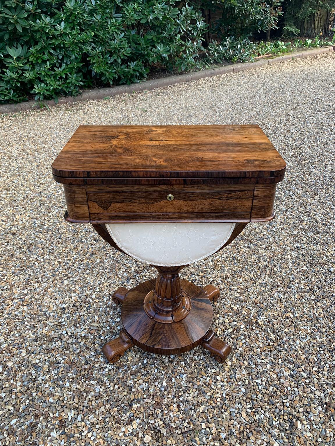 A high quality William IV Rosewood fold-over chess table, fitted with a drawer and well, on a platform base.