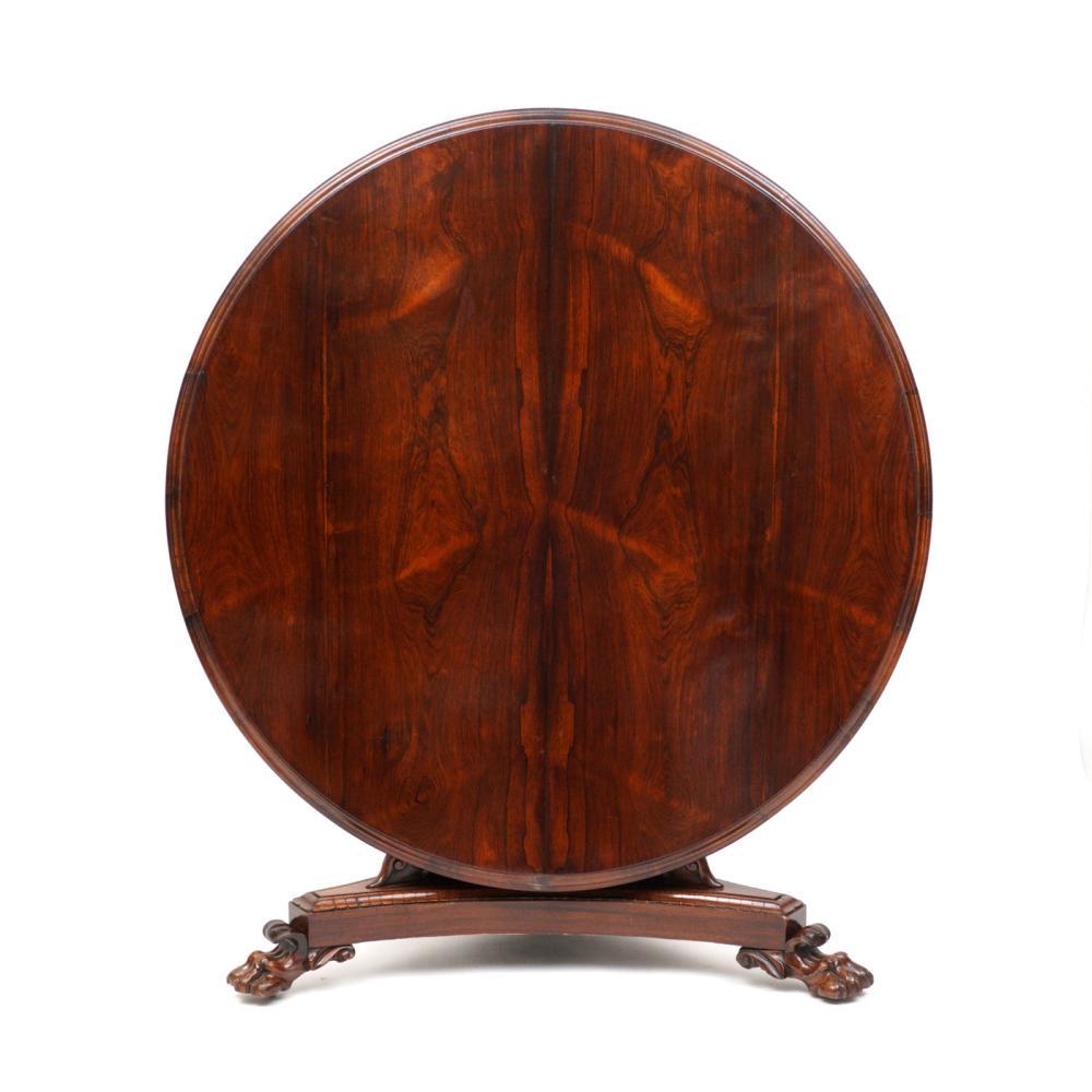 Period early 19th century English rosewood center table or breakfast table of Thomas Hope Pyramidal Form. Tilt top mechanism. Well matched Rosewood. Paw feet. All orginal

Provenance: Asprey, London and New York.