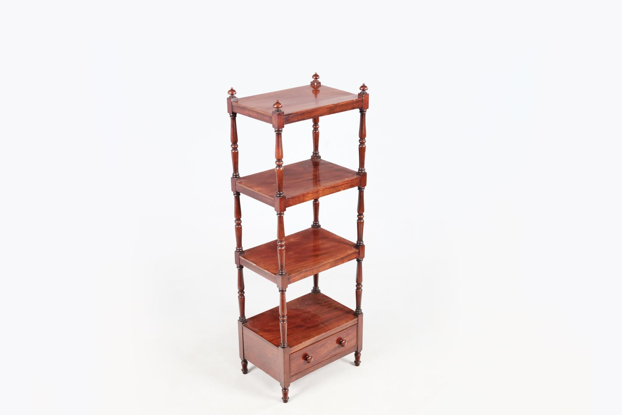 19th century William IV Style mahogany étagère, colloquially referred to as a ‘whatnot’, with four square shelves above single base drawer with turned knobs, standing on turned feet. It features turned column supports between the shelves and is