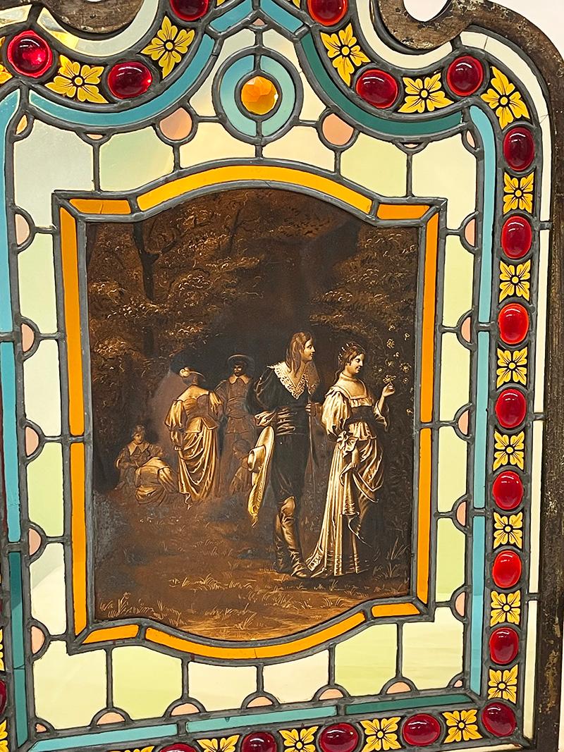 19th Century Window panels in stained glass

A set of 2 panels made of stained glass with scenes of characters walking in the forest and women with children in an interior. With colorful antique glass and round glass inserts, some with star shape or