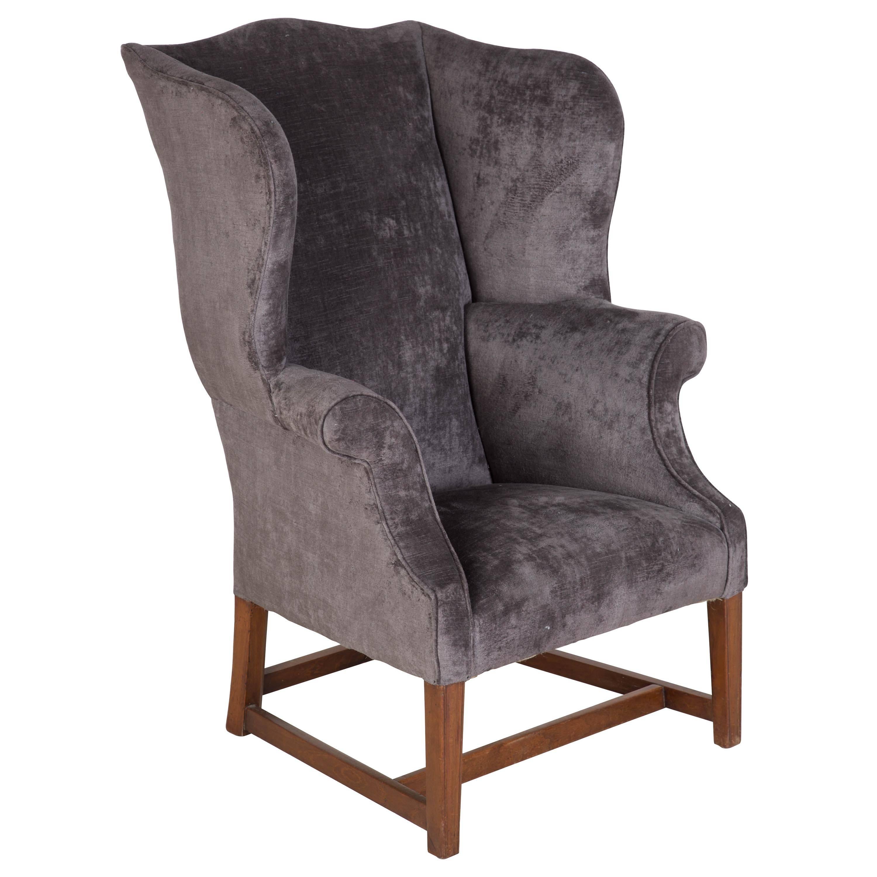 A well proportioned mid-19th century English wing armchair recovered in velvet. Seat height: 40cm.