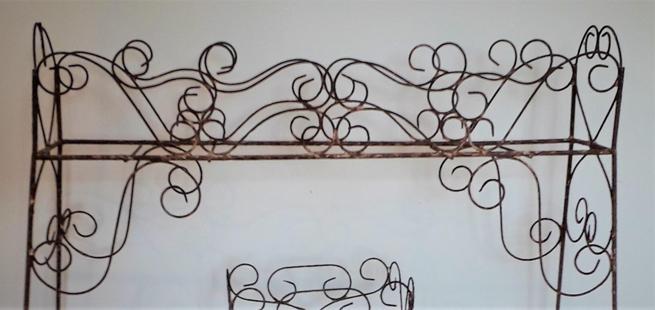 19th century wirework jardinière scrolled end supports with upper and one lower tray,
untouched and in totally original condition.